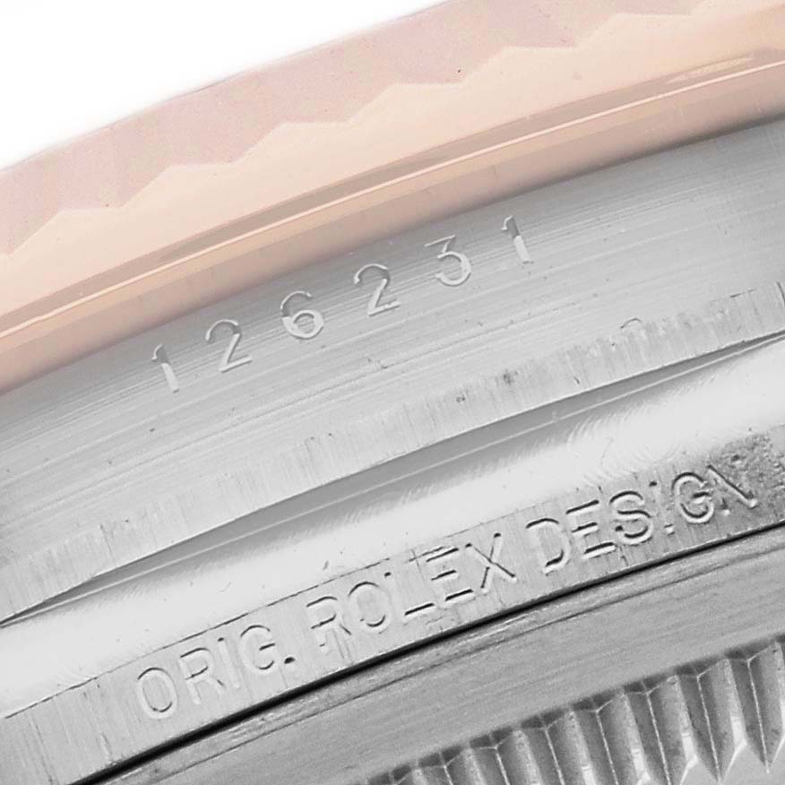 The image shows the side engraving of a Rolex Datejust 126231 Men's Steel and Gold (two tone) Grey Dial 126231 Men's Steel and Gold (two tone) Grey Dial bezel with its model and design details.