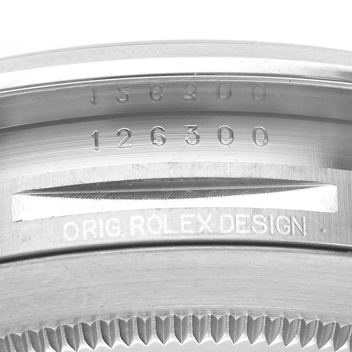 The image shows a close-up of the inner bezel engraving on a Rolex Datejust 41 126300 Men's Stainless Steel Black Dial 126300 Men's Stainless Steel Black Dial watch, featuring the model number and design details.