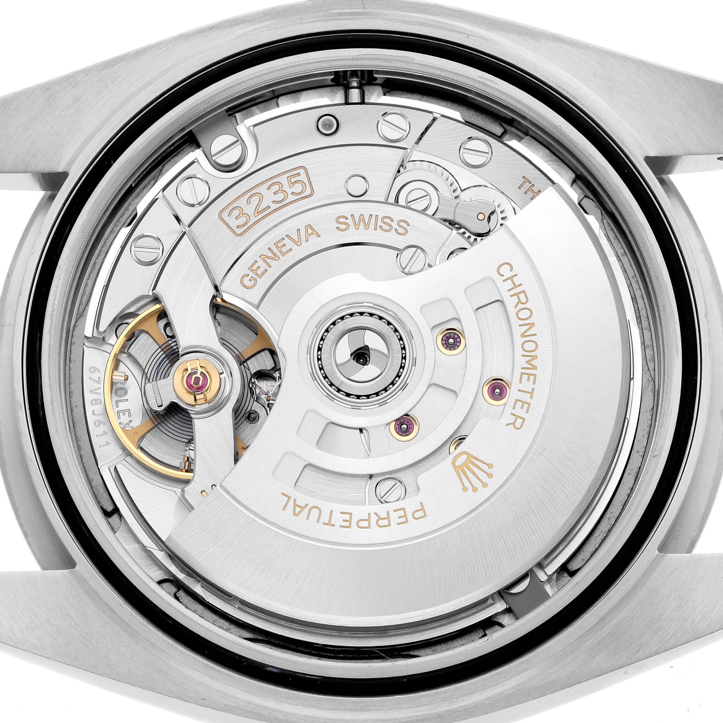 The image shows the movement of a Rolex Datejust 41 126334 Men
s Stainless Steel Blue Dial, viewed from the back, highlighting the rotor and mechanism details.