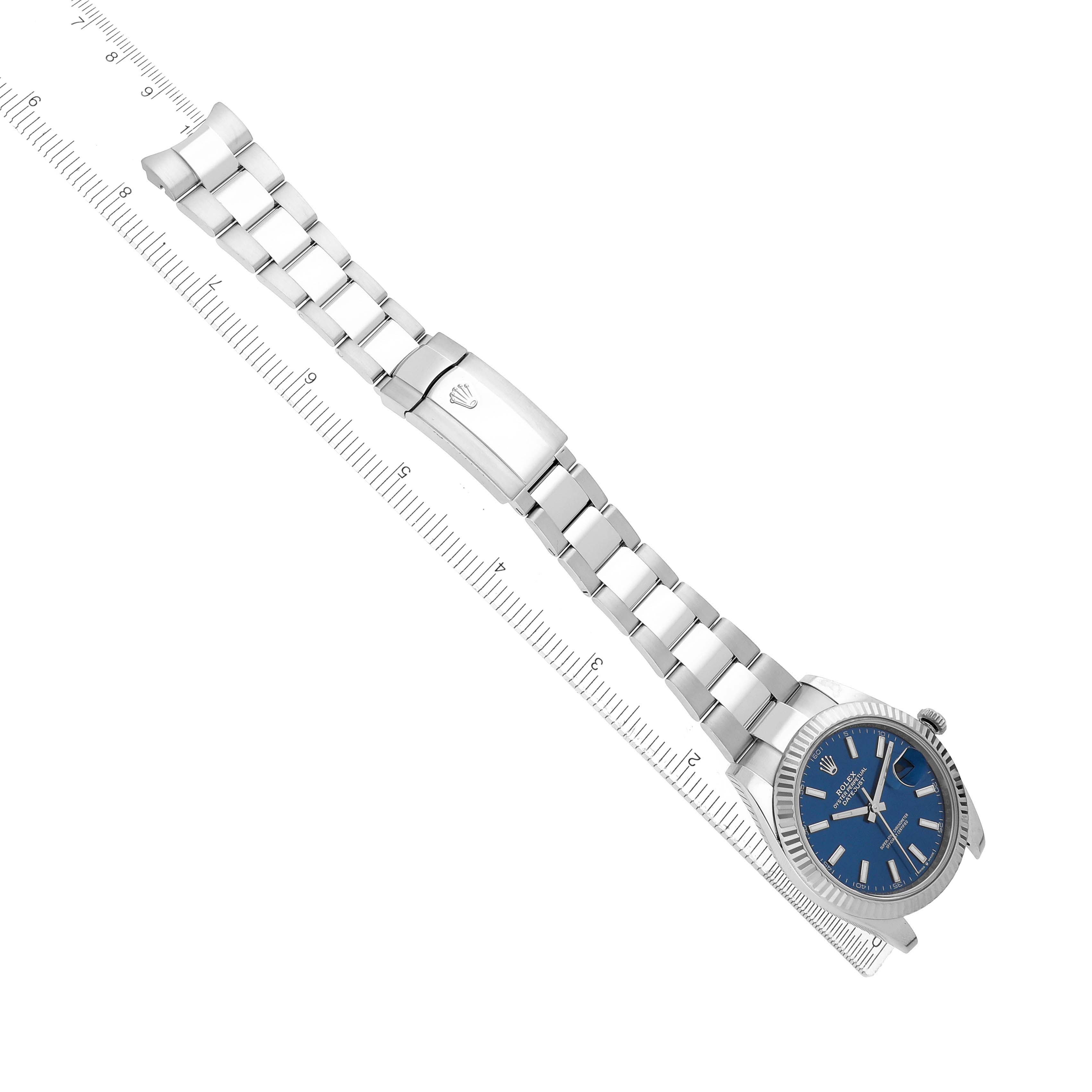 The Rolex Datejust 41 126334 Men
s Stainless Steel Blue Dial is shown from a top-down angle, featuring its bracelet, clasp, and blue dial.