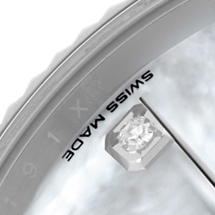 The image shows a close-up view of the dial and bezel edge of a Rolex Datejust 41 126334 Men's Stainless Steel Mother of Pearl Dial 126334 Men's Stainless Steel Mother of Pearl Dial, highlighting the diamond marker and "SWISS MADE" text.