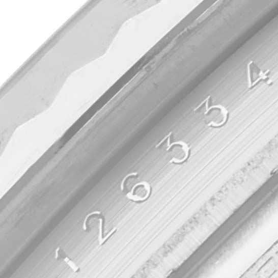 The image shows a close-up of the Rolex Datejust 41 126334 Men's Stainless Steel Mother of Pearl Dial 126334 Men's Stainless Steel Mother of Pearl Dial's fluted bezel and engraved numbers.