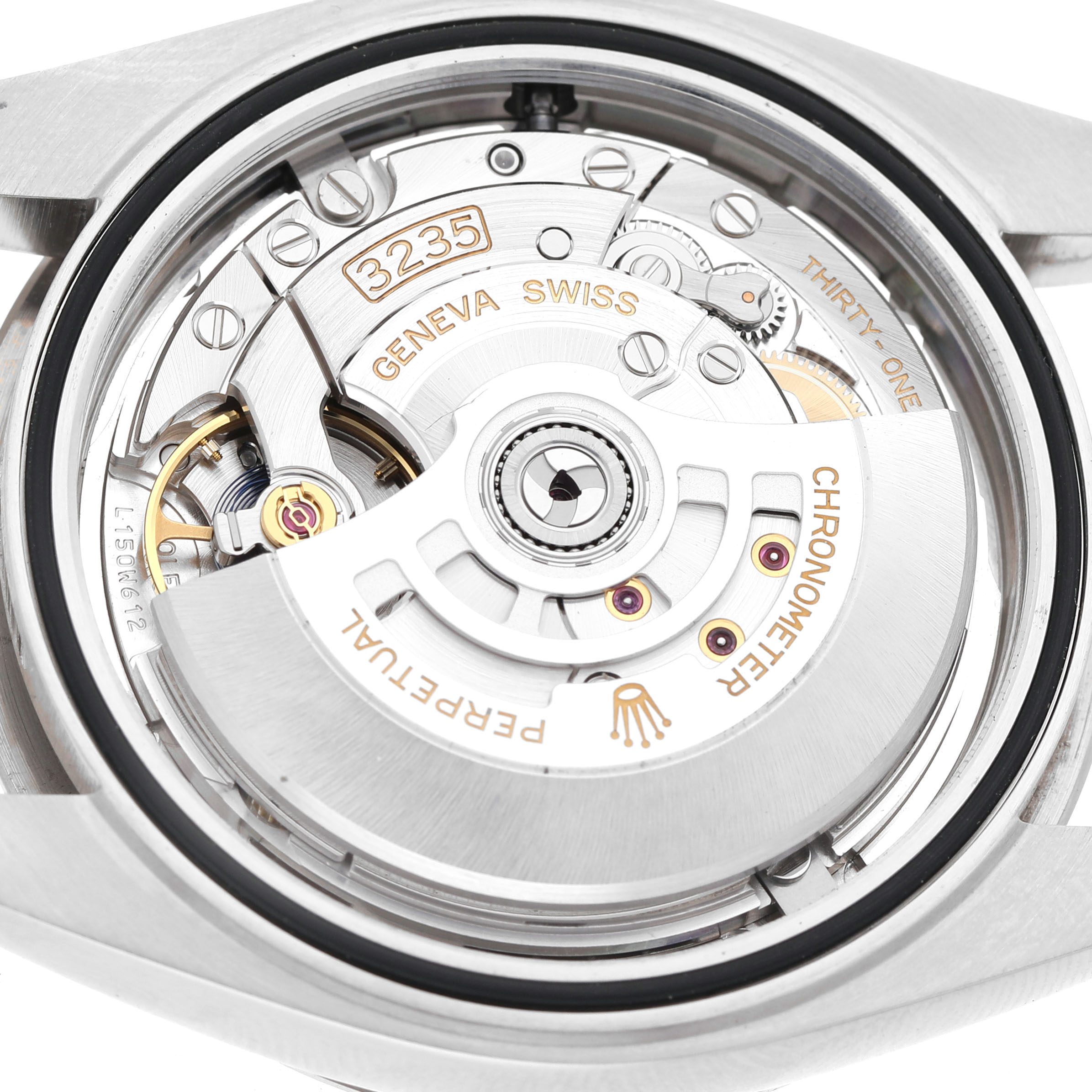 The image shows a close-up of the Rolex Datejust 41 126334 Men's Stainless Steel Silver Dial's movement from the back, highlighting the rotor and intricate components.