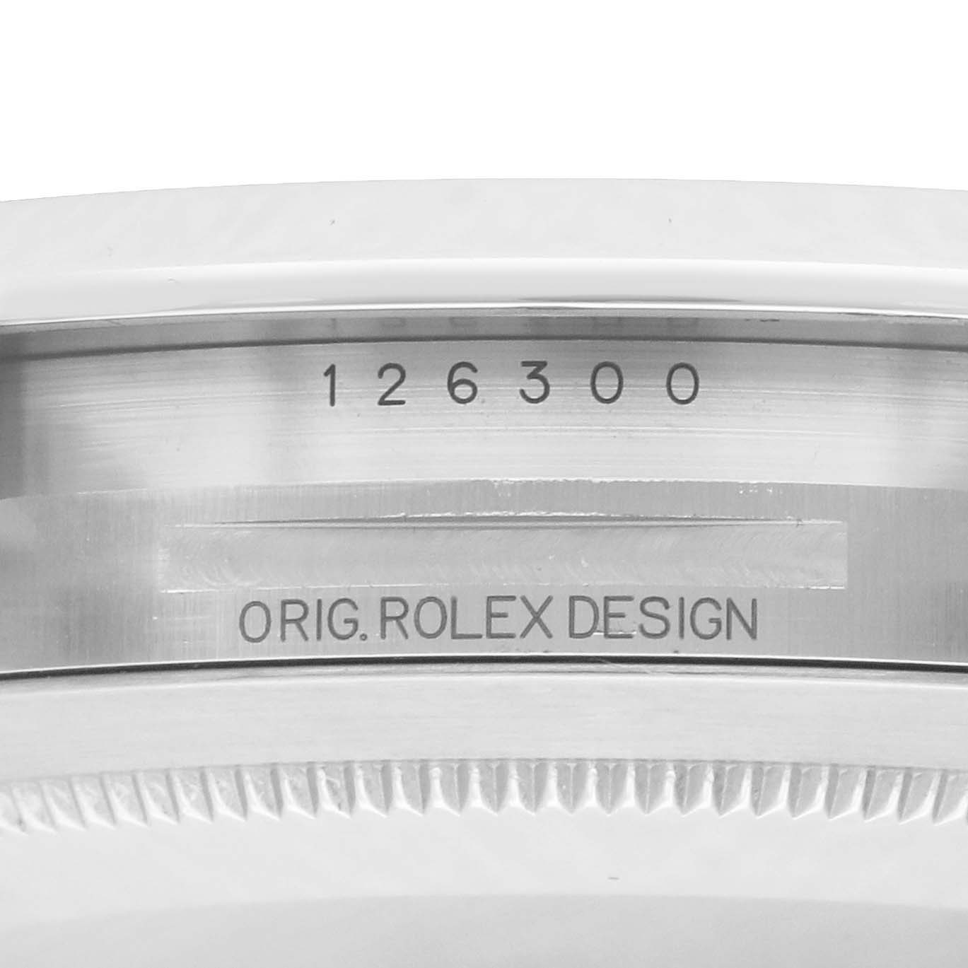 The image shows the inner bezel of a Rolex Datejust 41 126300 Men
s Stainless Steel White Dial, featuring its model number and "ORIG. ROLEX DESIGN" engraving.