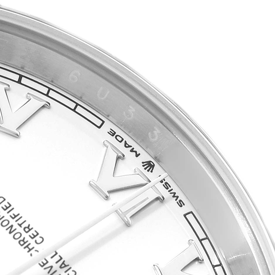 The image shows a close-up of the Rolex Datejust 41 126300 Men
s Stainless Steel White Dial, focusing on the Roman numeral markers and the "SWISS MADE" text near the edge.