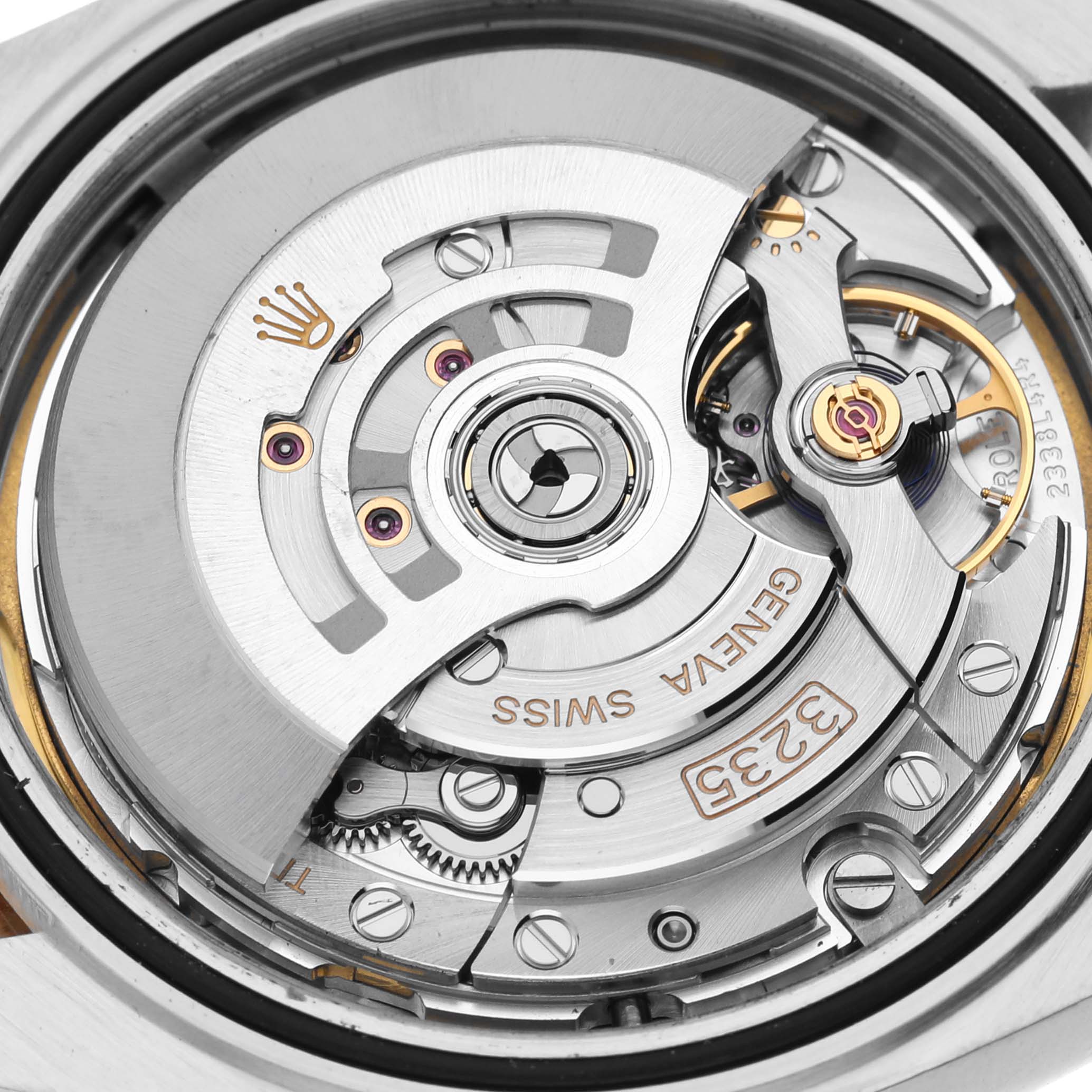 The image shows a detailed view of the Rolex Datejust 41 126303 Men's Steel and Gold (two tone) White Dial 126303 Men's Steel and Gold (two tone) White Dial movement and rotor.