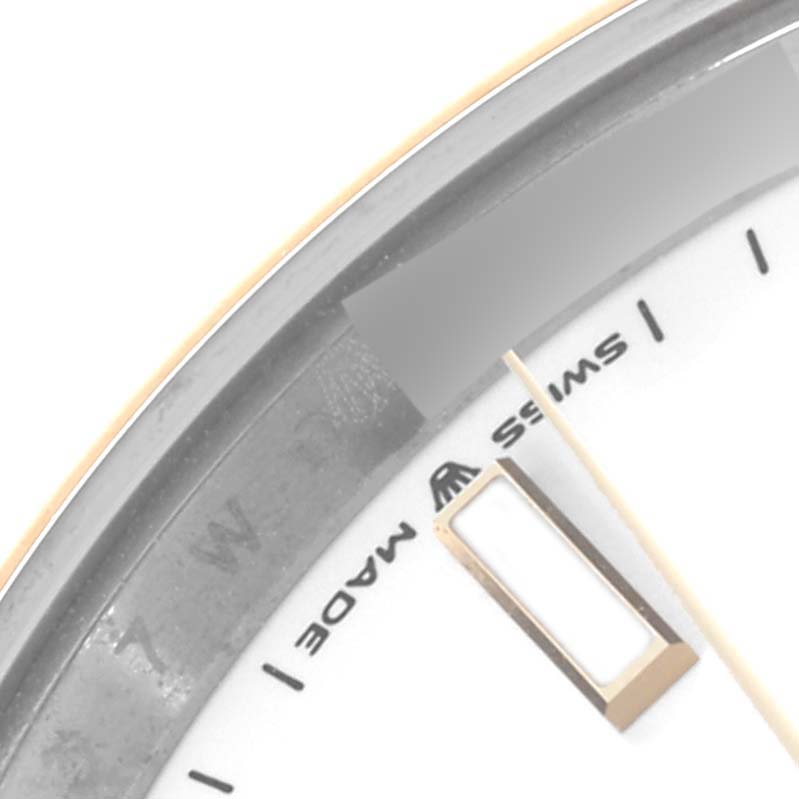 The image shows a close-up of the dial and chapter ring of a Rolex Datejust 41 126303 Men's Steel and Gold (two tone) White Dial 126303 Men's Steel and Gold (two tone) White Dial, highlighting the “Swiss Made” text.