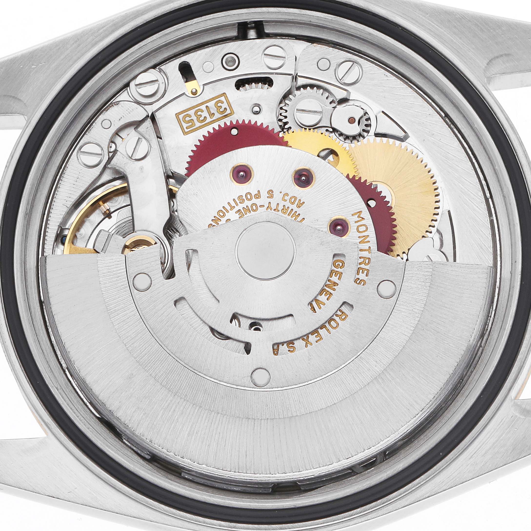 The image shows the movement mechanism of a Rolex Datejust 16233 Men
s Steel and Gold (two tone) Champagne Dial watch from a top-down angle, displaying the rotor and gears.