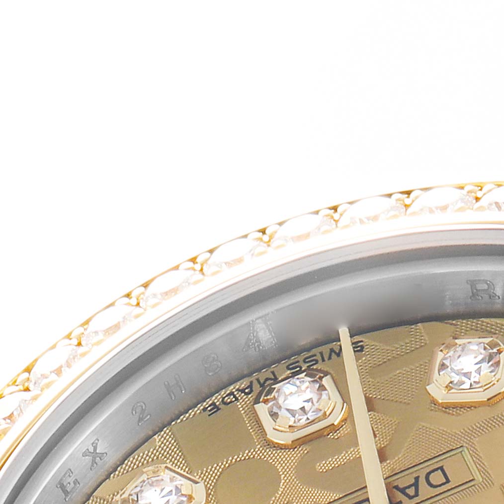 The image shows a close-up of the Rolex Datejust 179383 Women
s Steel and Gold (two tone) Champagne Dial
s bezel and part of the diamond-studded dial at an angle.