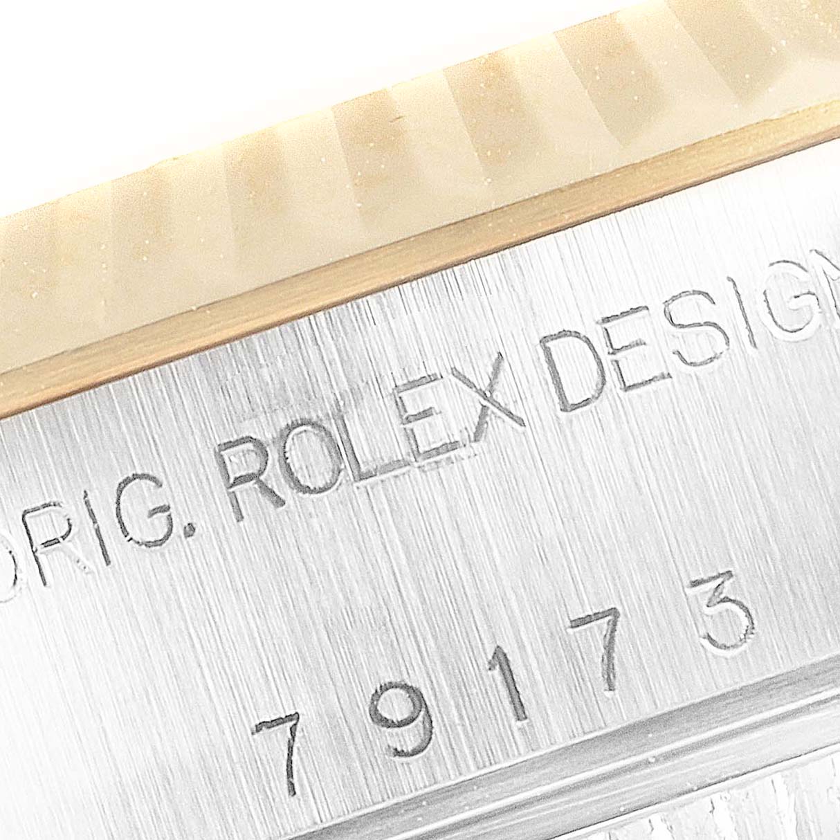 The image shows a close-up of the engraved model number and bezel of the Rolex Datejust 79173 Women's Yellow Gold Mother of Pearl Dial 79173 Women's Yellow Gold Mother of Pearl Dial watch.