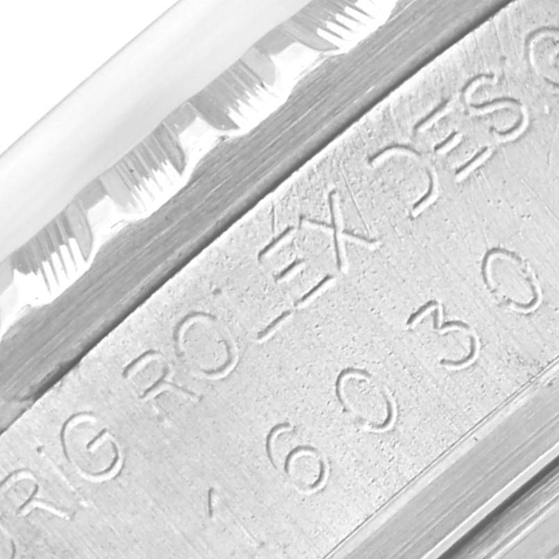 The image shows a close-up of the engraved bezel of a Rolex Vintage Collection 16030 Men's Stainless Steel White Dial 16030 Men's Stainless Steel White Dial watch.