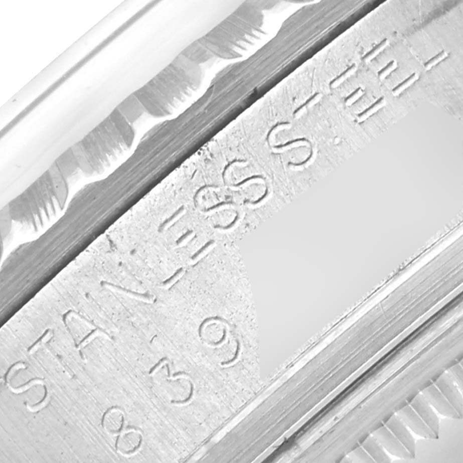 The image shows an angled close-up of the engraved casing of a Rolex Vintage Collection 16030 Men's Stainless Steel White Dial 16030 Men's Stainless Steel White Dial watch.