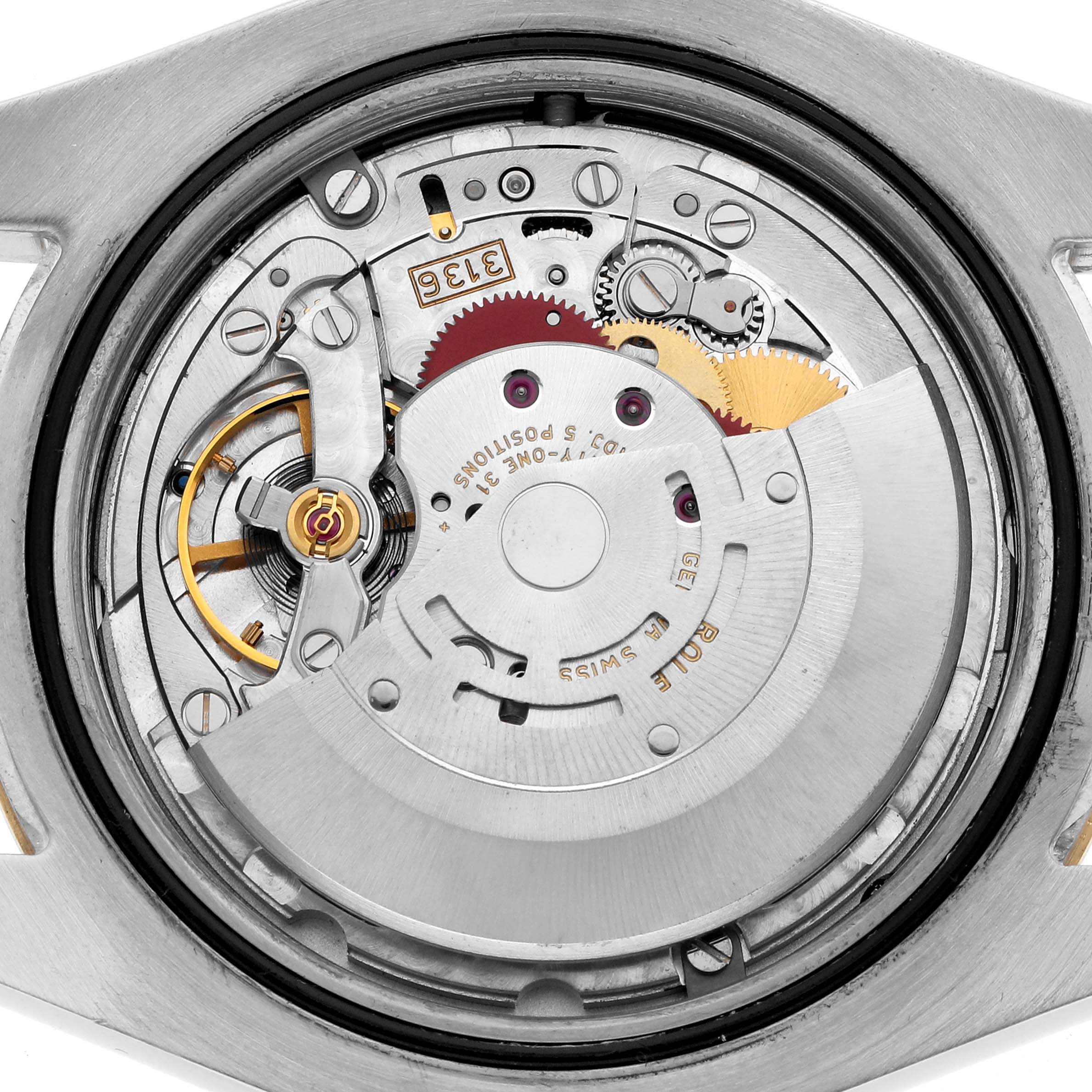 The image shows a close-up view of the mechanical movement inside a Rolex Datejust 41 116333 Men
s Steel and Gold (two tone) Silver Dial, highlighting gears and components.
