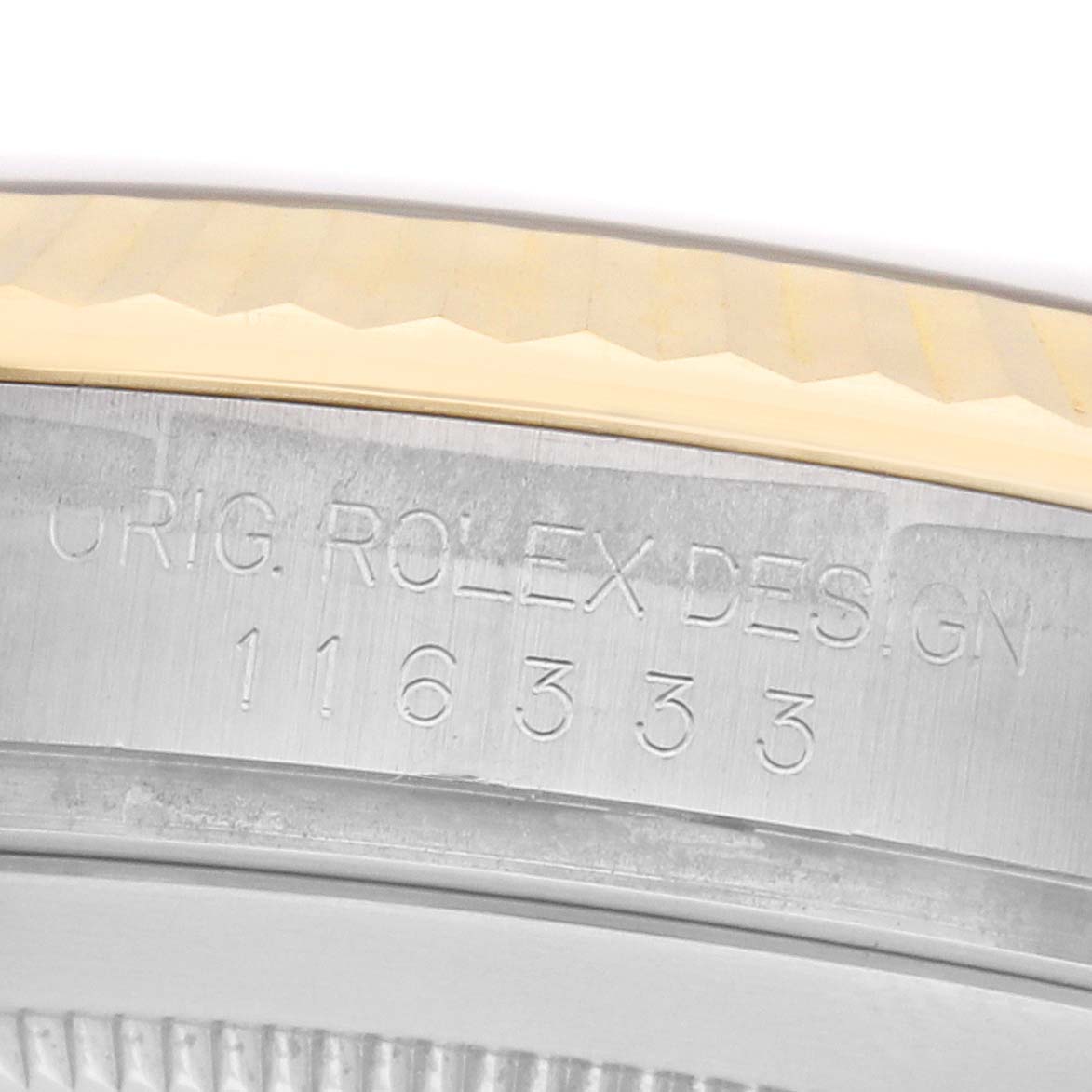 The image shows a close-up of the side of a Rolex Datejust 41 116333 Men
s Steel and Gold (two tone) White Dial, highlighting the engraved serial number and design details.