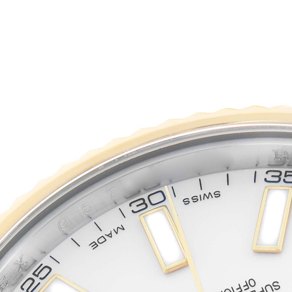 The image shows a close-up of the bezel and dial edge of a Rolex Datejust 41 116333 Men
s Steel and Gold (two tone) White Dial, highlighting the numerals and markers.