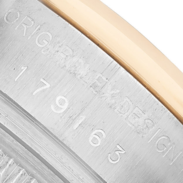 The image shows a close-up of the case back engraving on a Rolex Datejust 179163 Women's Steel and Gold (two tone) Blue Dial.