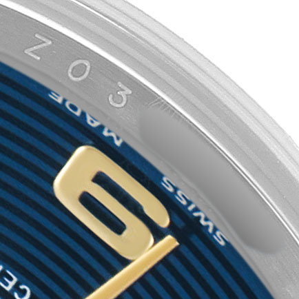 The image shows a close-up of the Rolex Datejust 179163 Women's Steel and Gold (two tone) Blue Dial, highlighting part of the dial with the number "6" and the edge of the bezel.