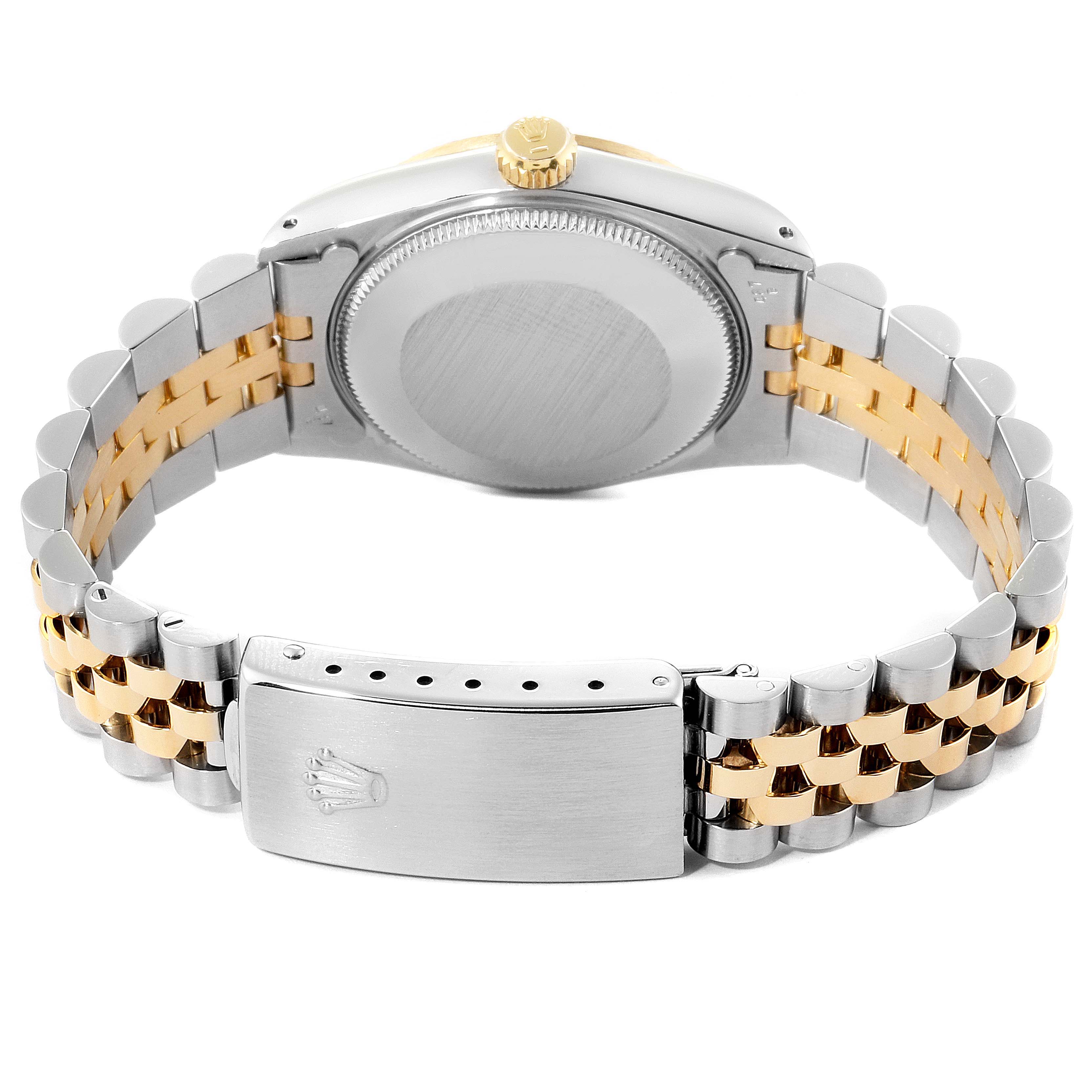 This image shows the back and clasp of a Rolex Mid-Size 68273 Women
s Steel and Gold (two tone) Champagne Dial 68273 Women
s Steel and Gold (two tone) Champagne Dial watch, highlighting the dual-tone metal bracelet.