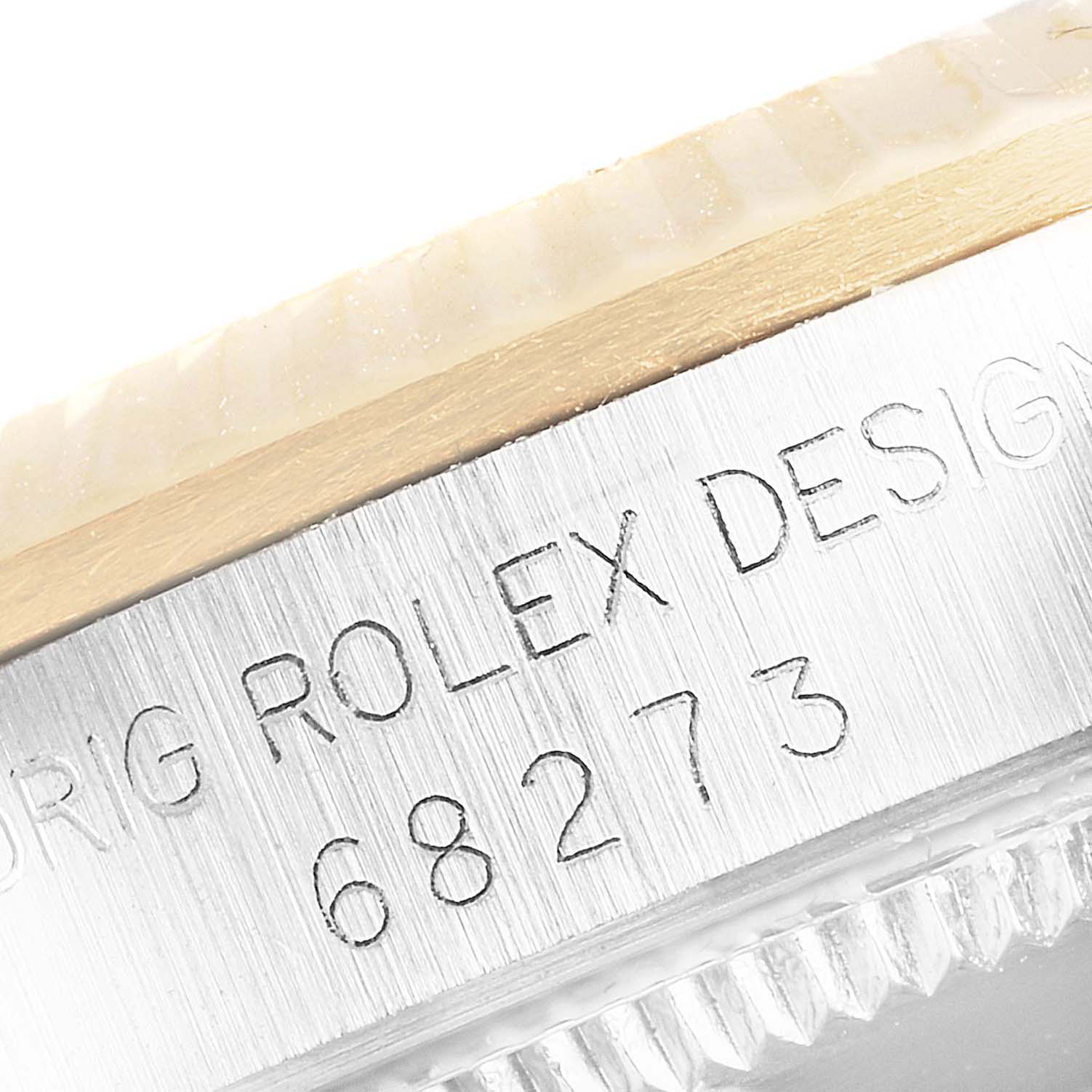 This image shows the engraved side case and part of the bezel for a Mid-Size Rolex watch, model number 68273.