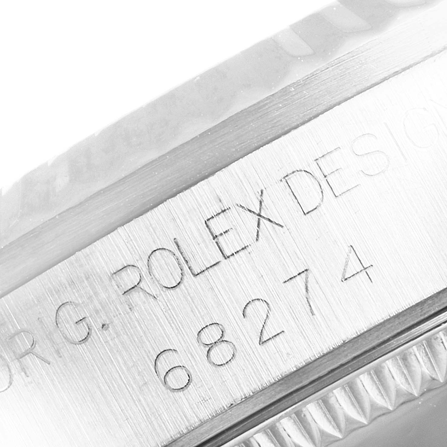 This image shows a close-up of the case side of the Rolex Datejust 68274 Women's Stainless Steel Silver Dial 68274 Women's Stainless Steel Silver Dial, focusing on its model number and the “Rolex Design” engraving.