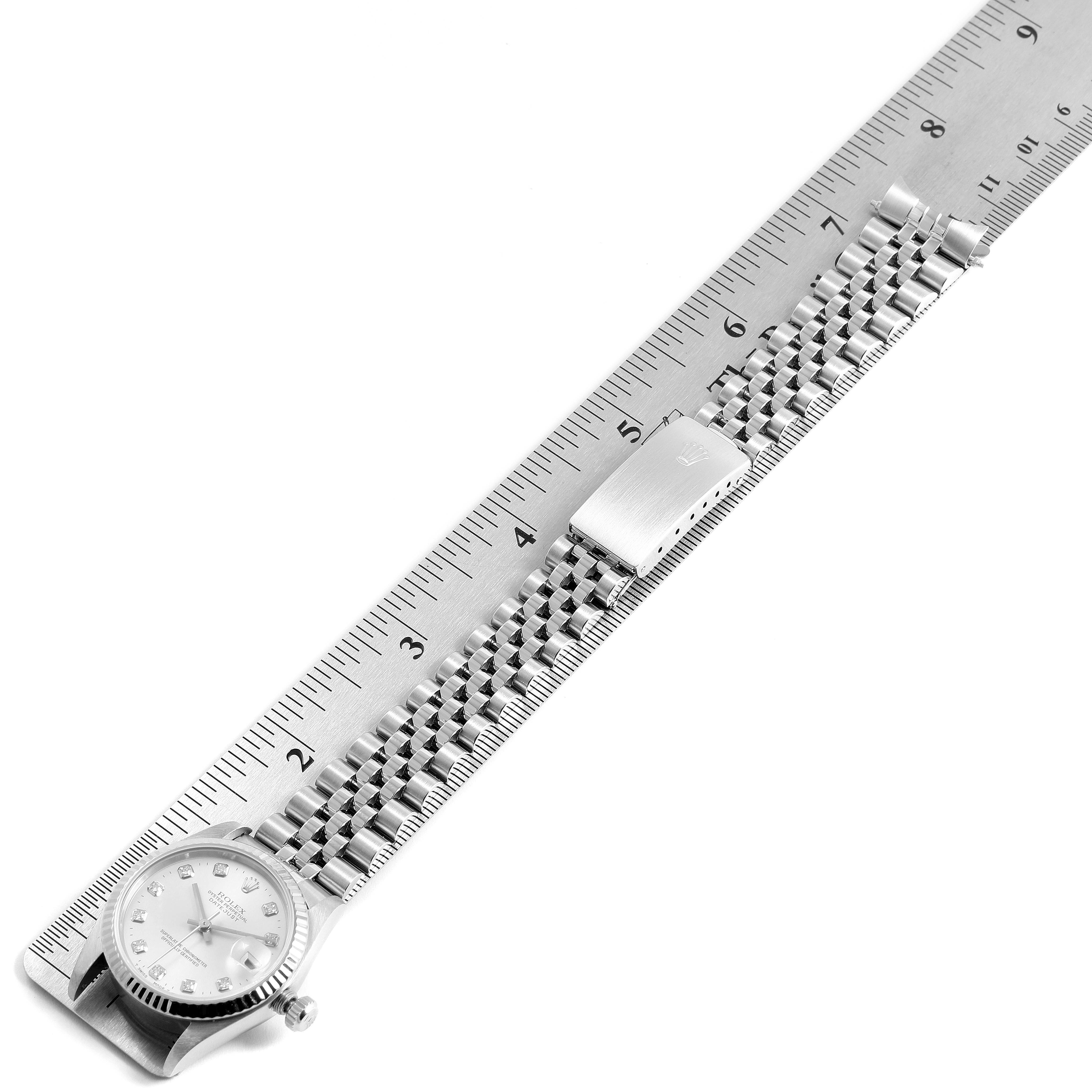 The image shows a Rolex Datejust 68274 Women's Stainless Steel Silver Dial 68274 Women's Stainless Steel Silver Dial watch fully extended next to a ruler for scale.