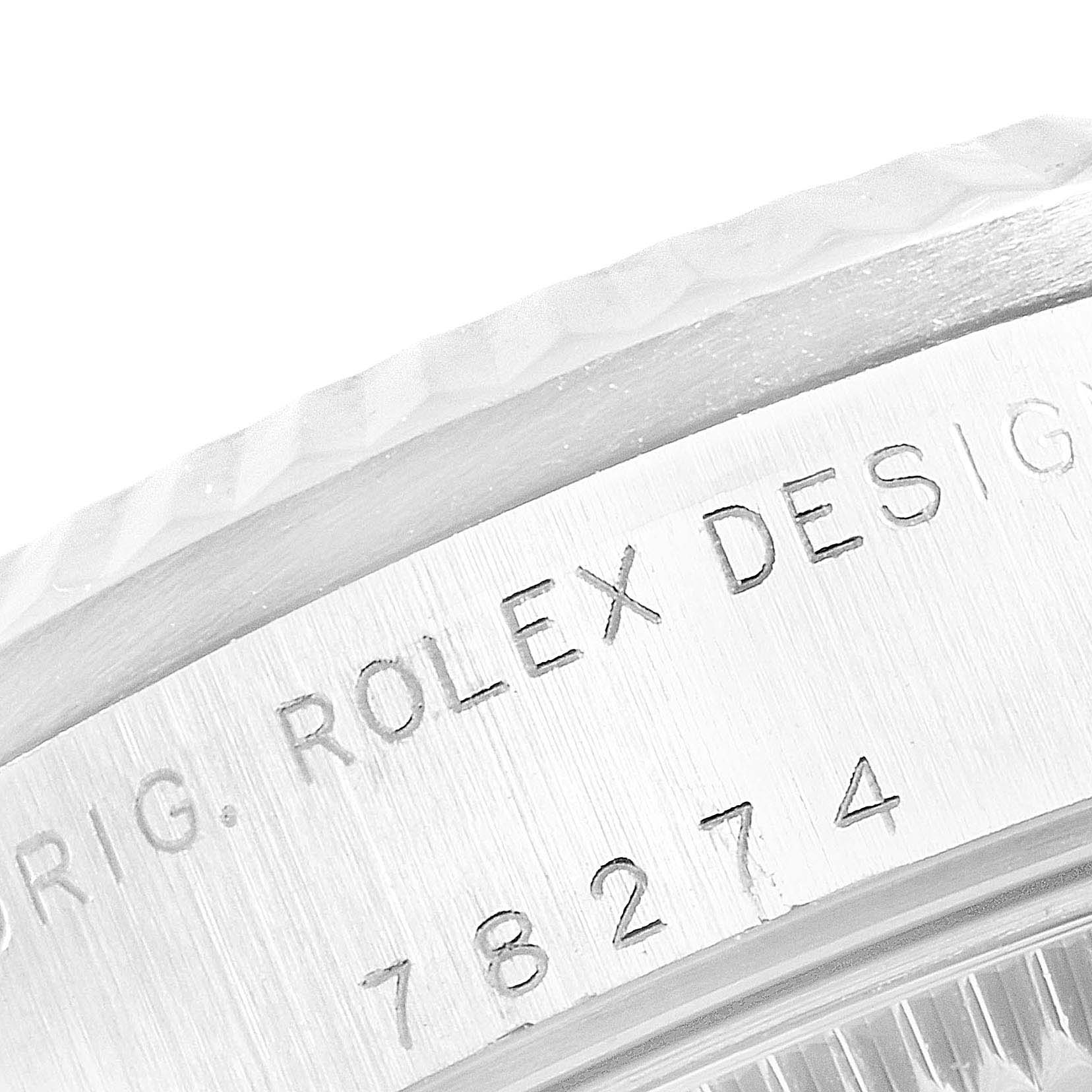 The image shows a close-up of the case back engraving of a Rolex Mid-Size 78274 Women
s Stainless Steel Mother of Pearl Dial 78274 Women
s Stainless Steel Mother of Pearl Dial watch, including the model number 78274.