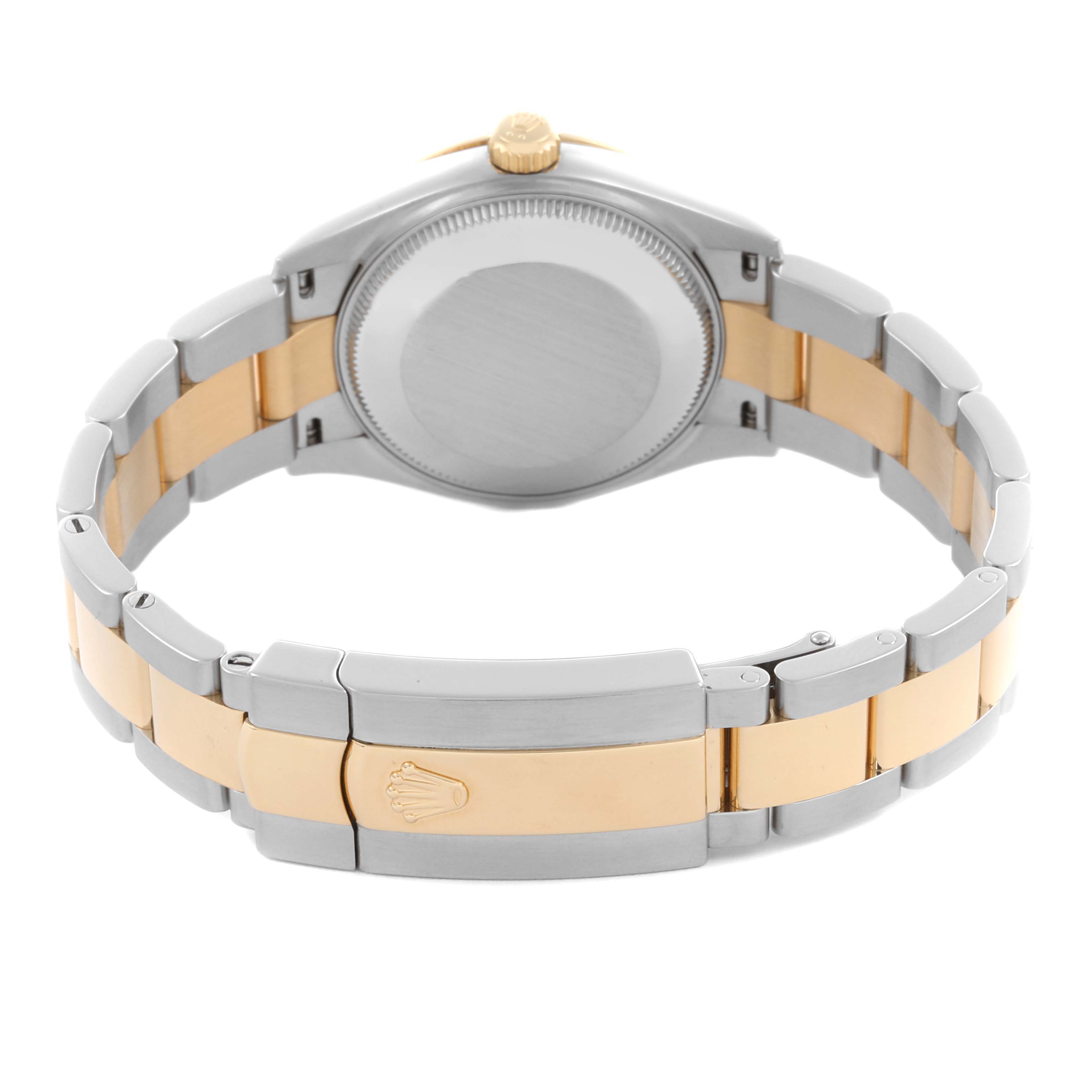 The Rolex Mid-Size 278273 Women's Steel and Gold (two tone) Green Dial 278273 Women's Steel and Gold (two tone) Green Dial watch is shown from the back, displaying its case back, bracelet, and clasp.