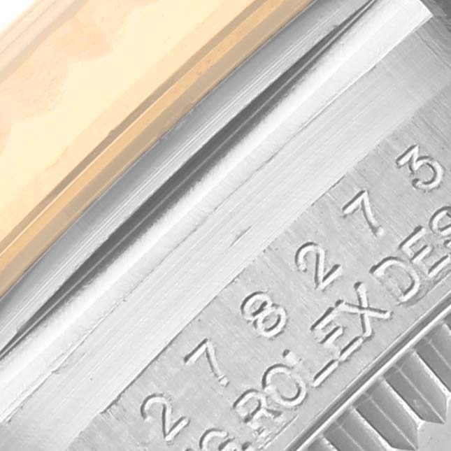 The image shows a close-up of the engraved side and bezel of a Rolex Mid-Size 278273 Women's Steel and Gold (two tone) Green Dial 278273 Women's Steel and Gold (two tone) Green Dial watch.