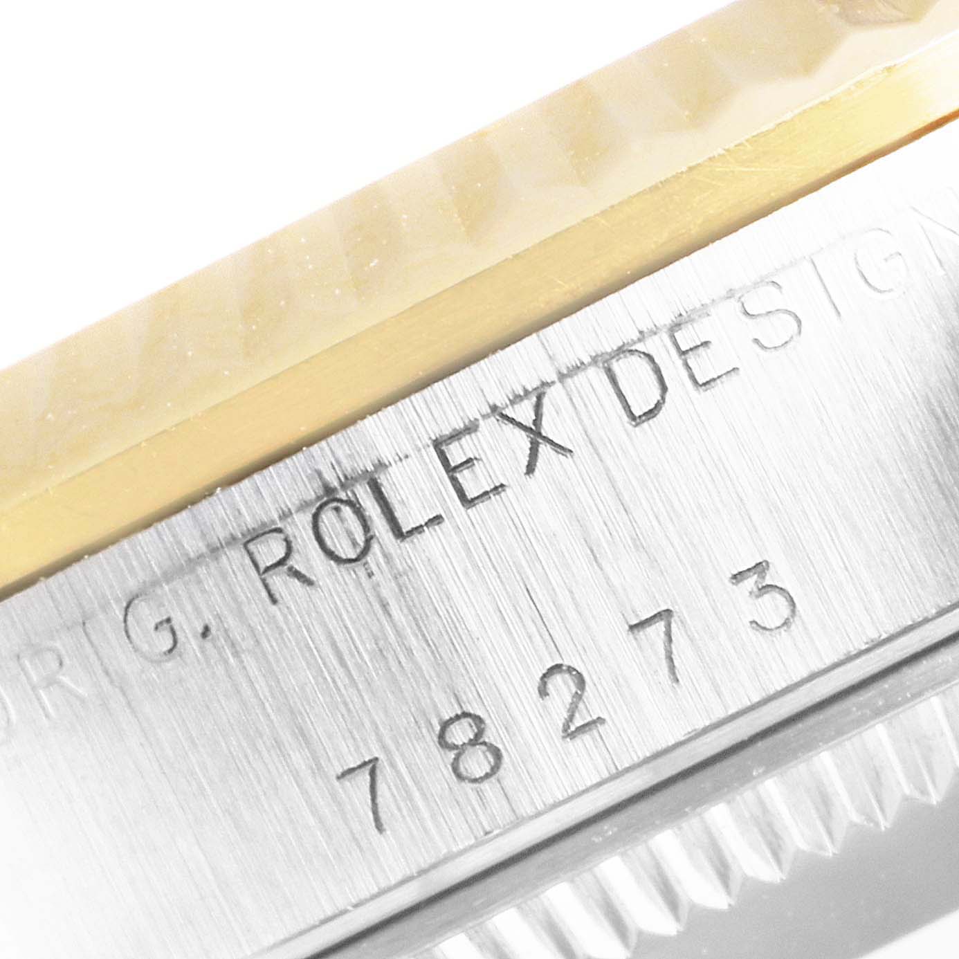 This image shows a close-up view of the Rolex Mid-Size 78273 Women
s Steel and Gold (two tone) Champagne Dial 78273 Women
s Steel and Gold (two tone) Champagne Dial watch case and bezel, revealing the model number 78273.