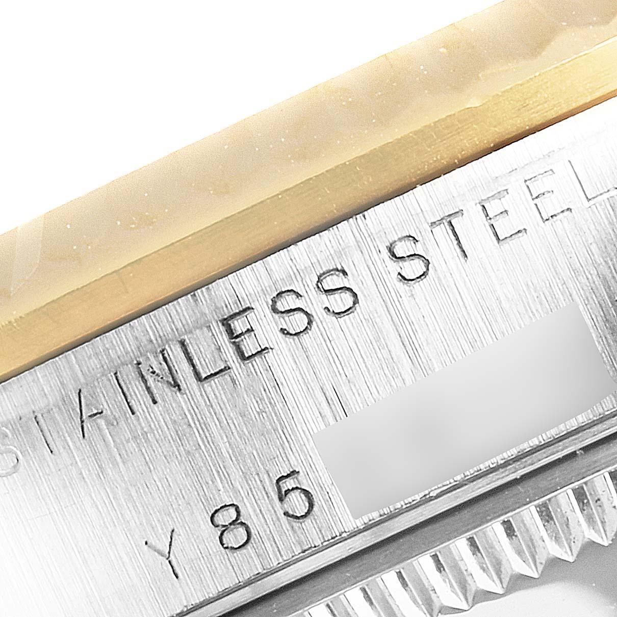 This close-up of a Rolex Mid-Size 78273 Women
s Steel and Gold (two tone) Champagne Dial 78273 Women
s Steel and Gold (two tone) Champagne Dial model shows the stainless steel and gold-plated bezel with part of the serial number visible.