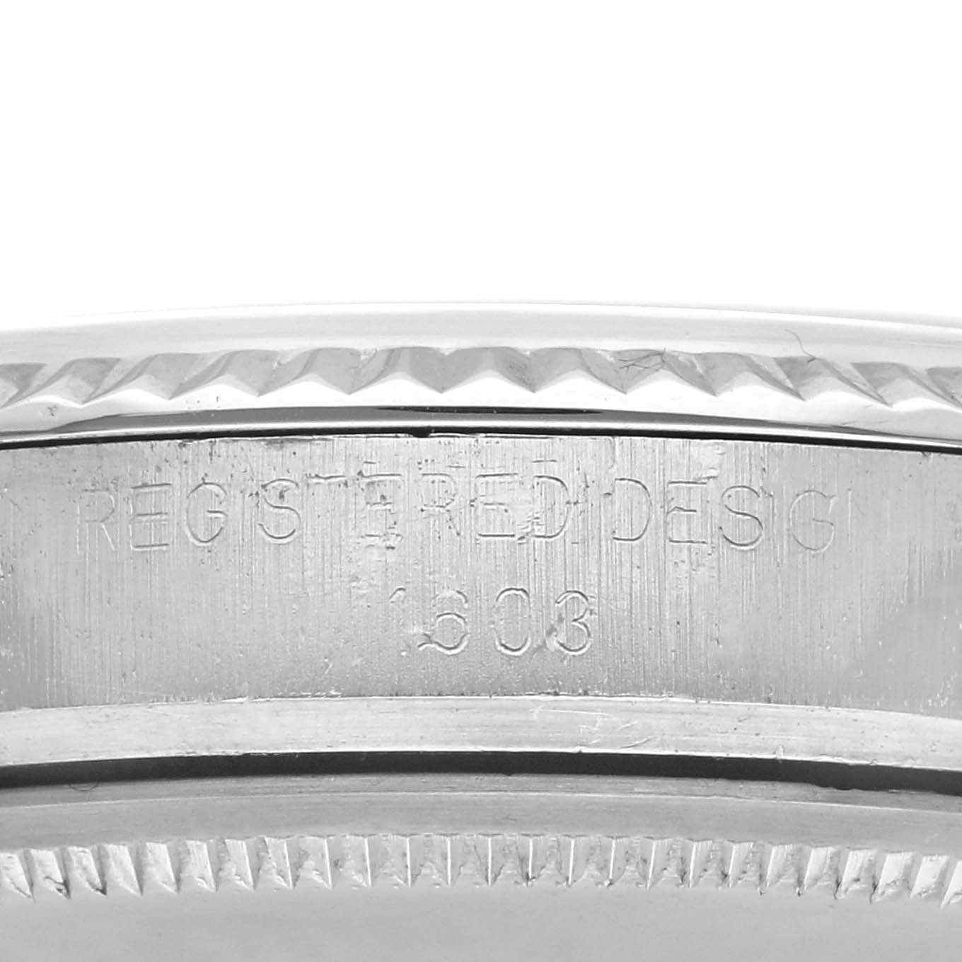 The image shows a close-up of the engraved side of a Rolex Vintage Collection 1603 Men's Stainless Steel Silver Dial 1603 Men's Stainless Steel Silver Dial model watch case.