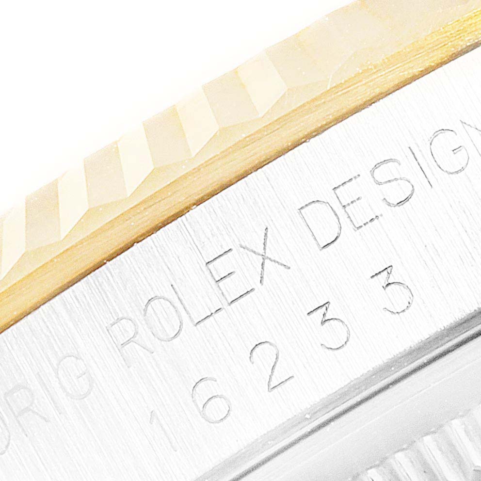This close-up image shows the side view of a Rolex Datejust 16233 Men's Steel and Gold (two tone) Champagne Dial 16233 Men's Steel and Gold (two tone) Champagne Dial watch's bezel and engraved model number.