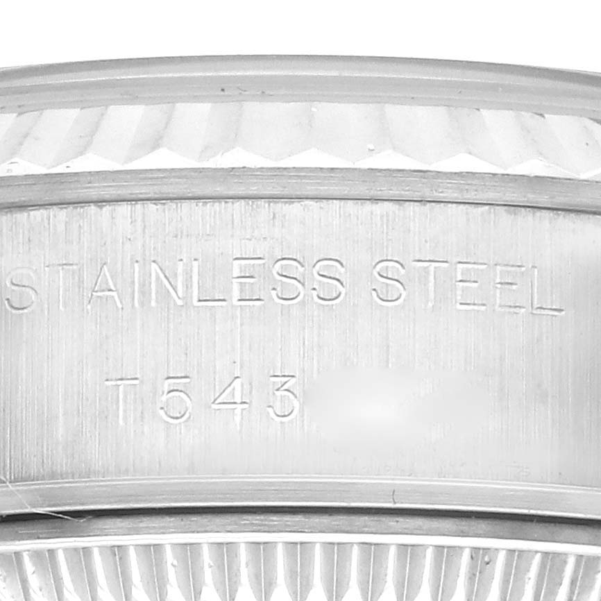 This image shows a close-up of the side engravings on a Rolex Datejust 69174 Women's Stainless Steel Silver Dial 69174 Women's Stainless Steel Silver Dial watch, highlighting "STAINLESS STEEL."