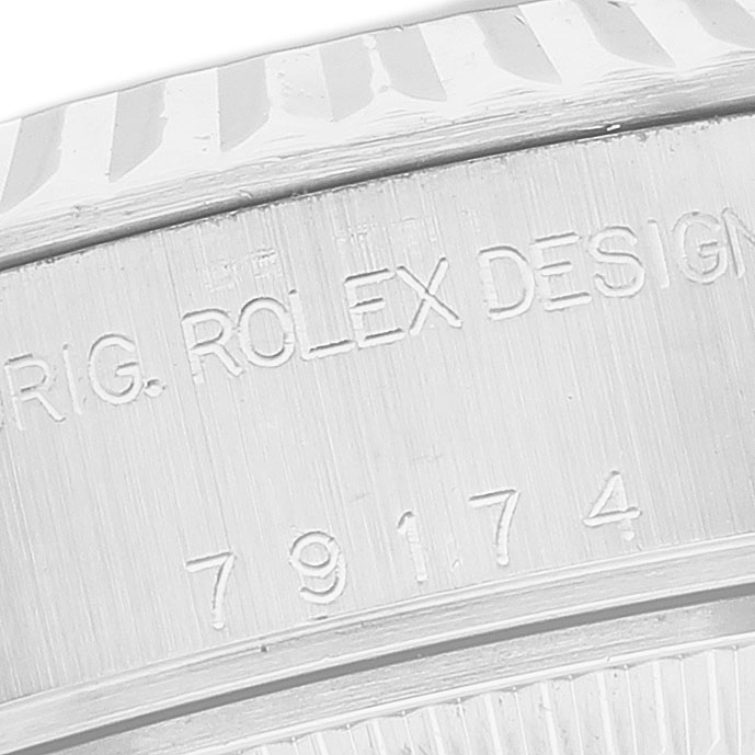 The image shows a close-up of the side of the Rolex Datejust 79174 Women's Stainless Steel Silver Dial watch, highlighting the engraved serial number.