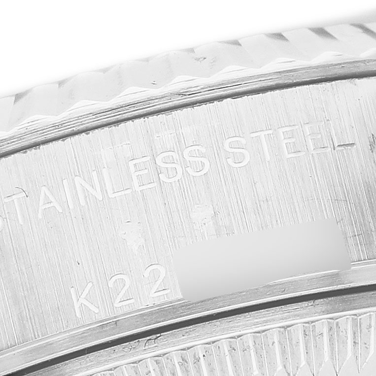 The image shows a close-up of the stainless steel case back of a Rolex Datejust 79174 Women's Stainless Steel Silver Dial watch, highlighting engraved details.