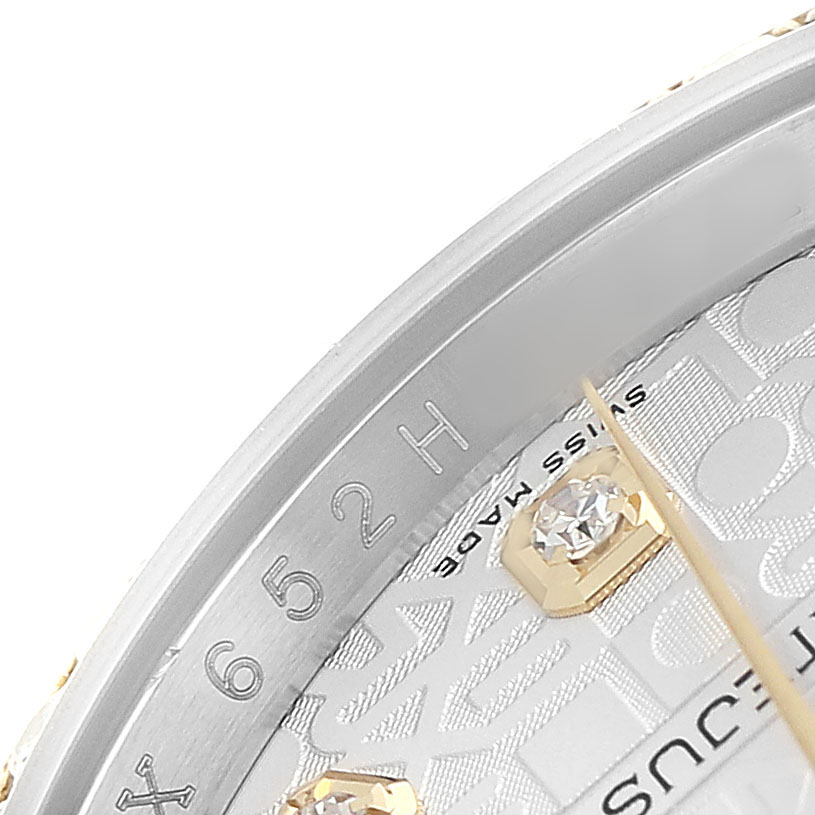 The image shows a close-up angle of the Rolex Datejust 116243 Men's Steel and Gold (two tone) Silver Dial watch face, highlighting the edge of the dial, part of the bezel, and a diamond marker.