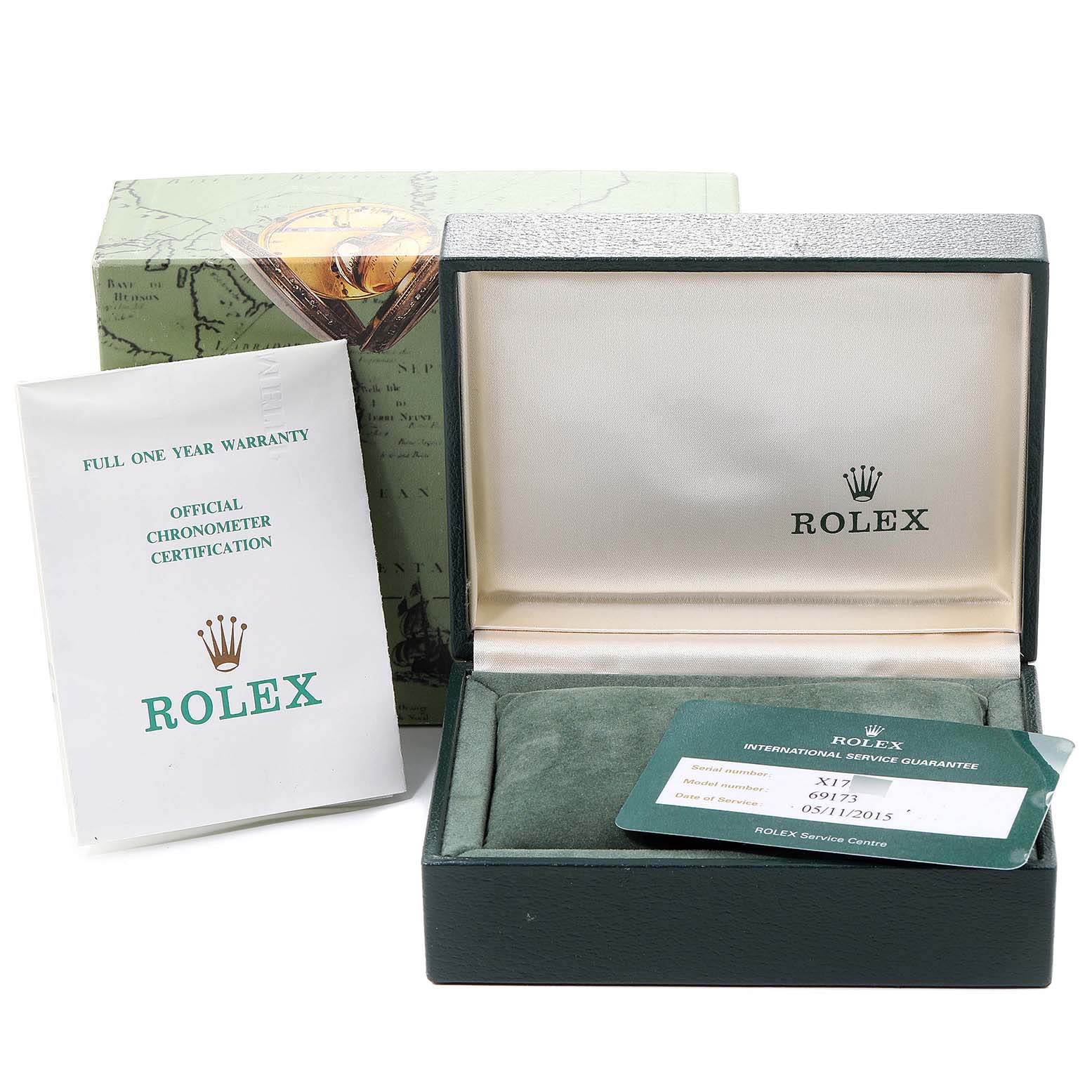 The image shows the open box, warranty card, and manuals for a Rolex Datejust 69173 Women
s Steel and Gold (two tone) Black Dial 69173 Women
s Steel and Gold (two tone) Black Dial watch, viewed from the front.