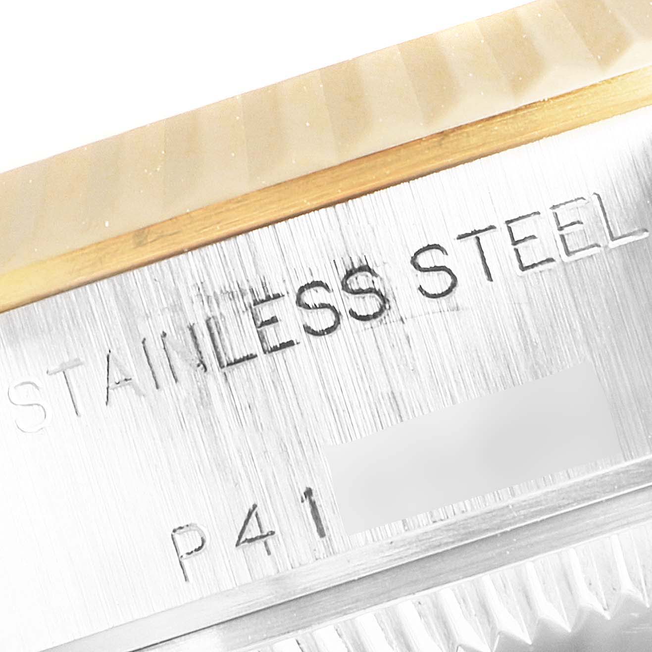 The image shows a close-up of the case edge and serial engraving on a Rolex Datejust 79173 Women's Steel and Gold (two tone) Champagne Dial 79173 Women's Steel and Gold (two tone) Champagne Dial watch.