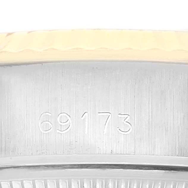 This close-up image shows the inner side of the bezel with the model number "69173" engraved on a Rolex Datejust 69173 Women's Steel and Gold (two tone) Champagne Dial 69173 Women's Steel and Gold (two tone) Champagne Dial watch.