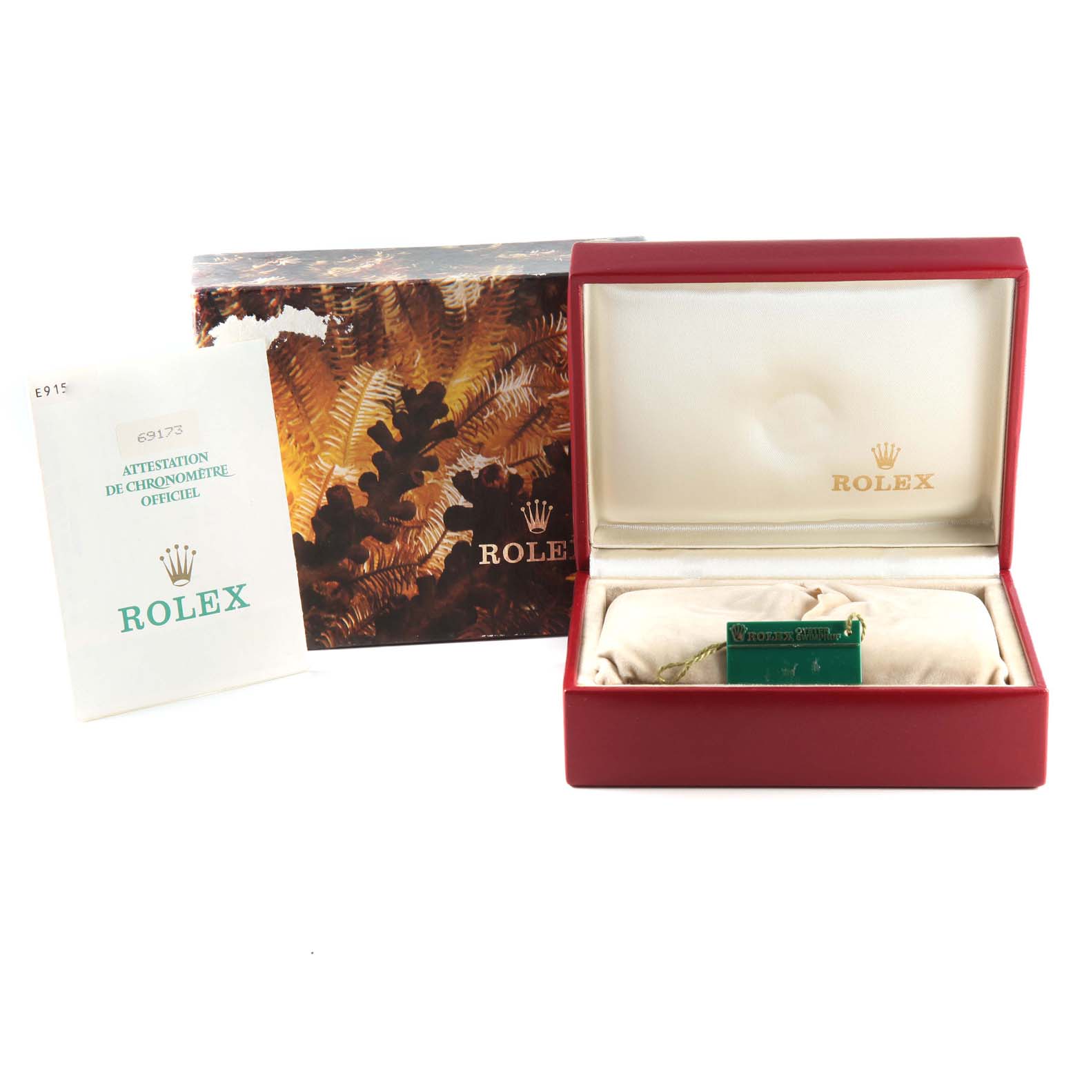 The image shows the packaging and accessories for a Rolex Datejust 69173 Women's Steel and Gold (two tone) Champagne Dial 69173 Women's Steel and Gold (two tone) Champagne Dial watch, including the box, certificate, and tag.