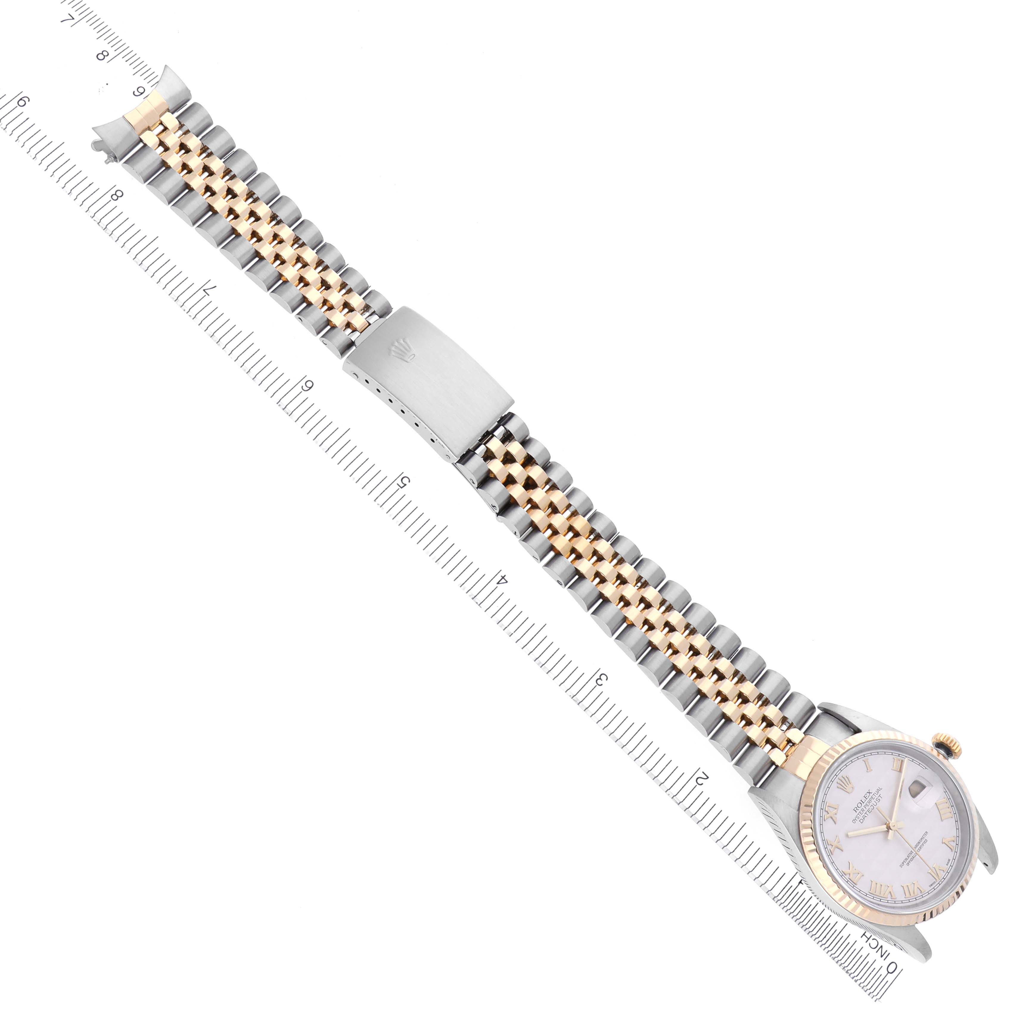 The image shows a Rolex Datejust 16233 Men
s Steel and Gold (two tone) White Dial 16233 Men
s Steel and Gold (two tone) White Dial watch from a top-down angle, highlighting the face, bezel, and jubilee bracelet.