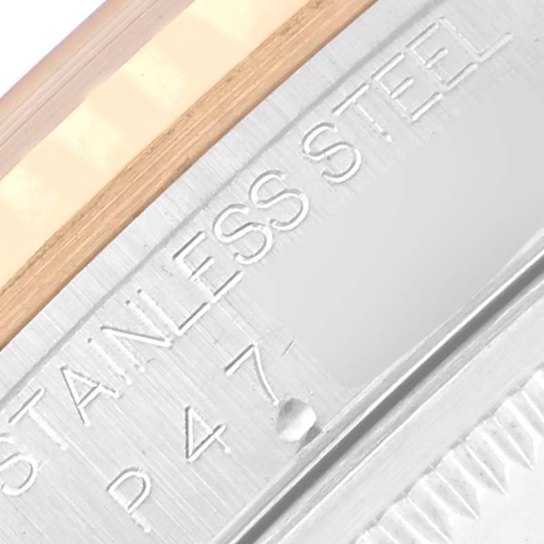 The image shows a close-up of the engraved case back of a Rolex Datejust 16233 Men
s Steel and Gold (two tone) White Dial 16233 Men
s Steel and Gold (two tone) White Dial, highlighting the "STAINLESS STEEL" text.