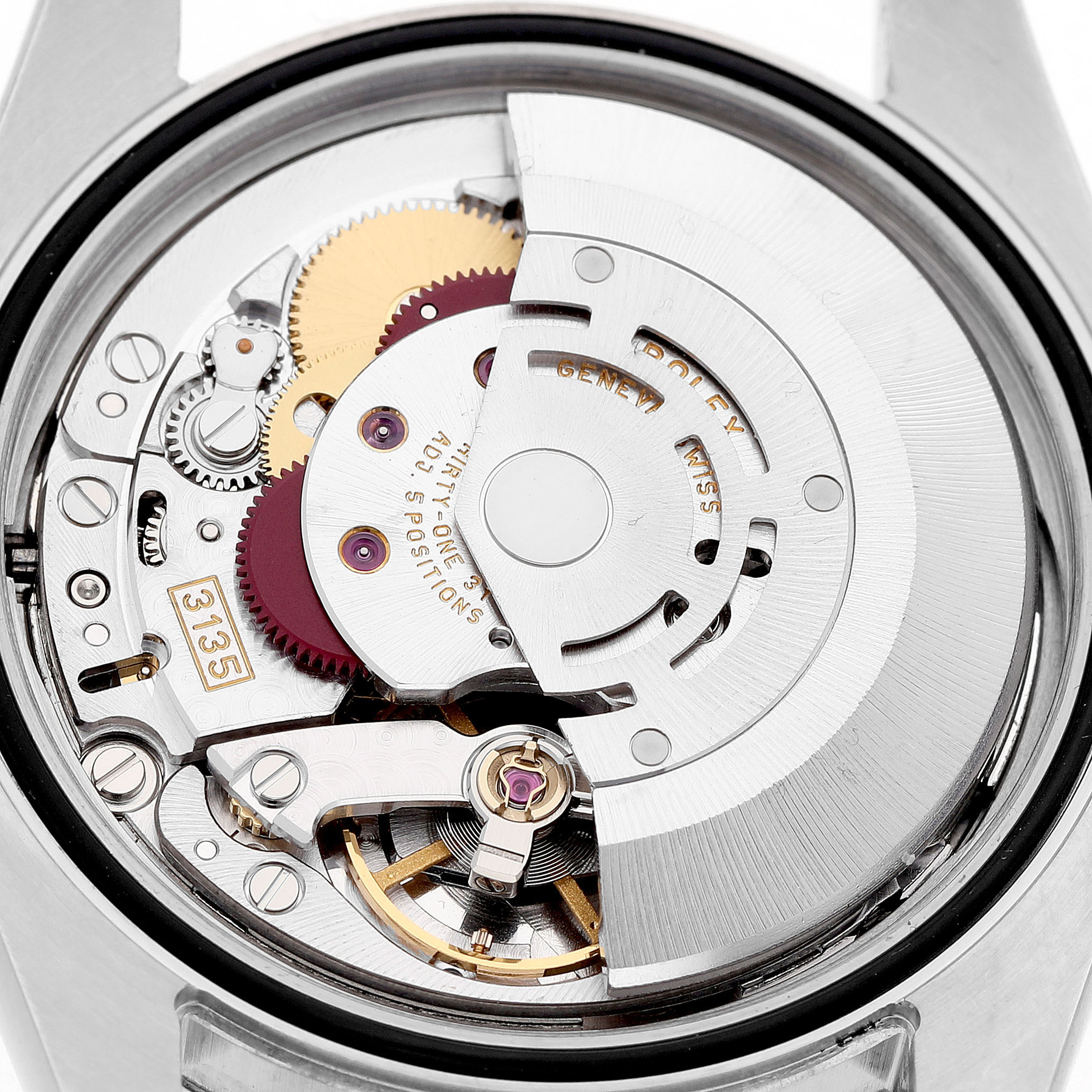 The image shows the movement of a Rolex Datejust 116203 Men's Steel and Gold (two tone) Grey Dial watch from a rear angle, highlighting intricate gears and mechanism parts.