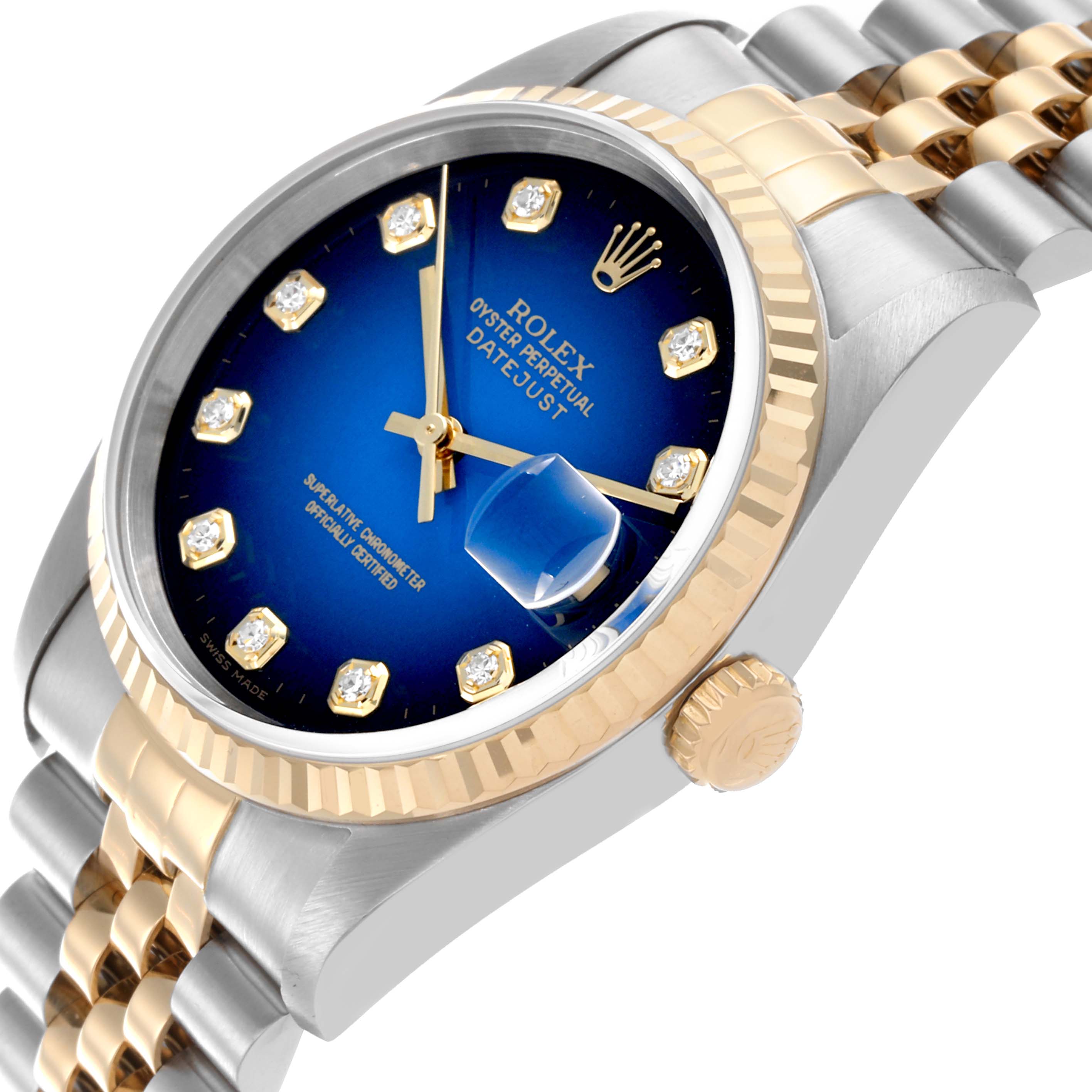 The Rolex Datejust 16233 Men's Steel and Gold (two tone) Blue Dial 16233 Men's Steel and Gold (two tone) Blue Dial watch is shown at an angle highlighting the blue dial, crown, and two-tone fluted bezel.