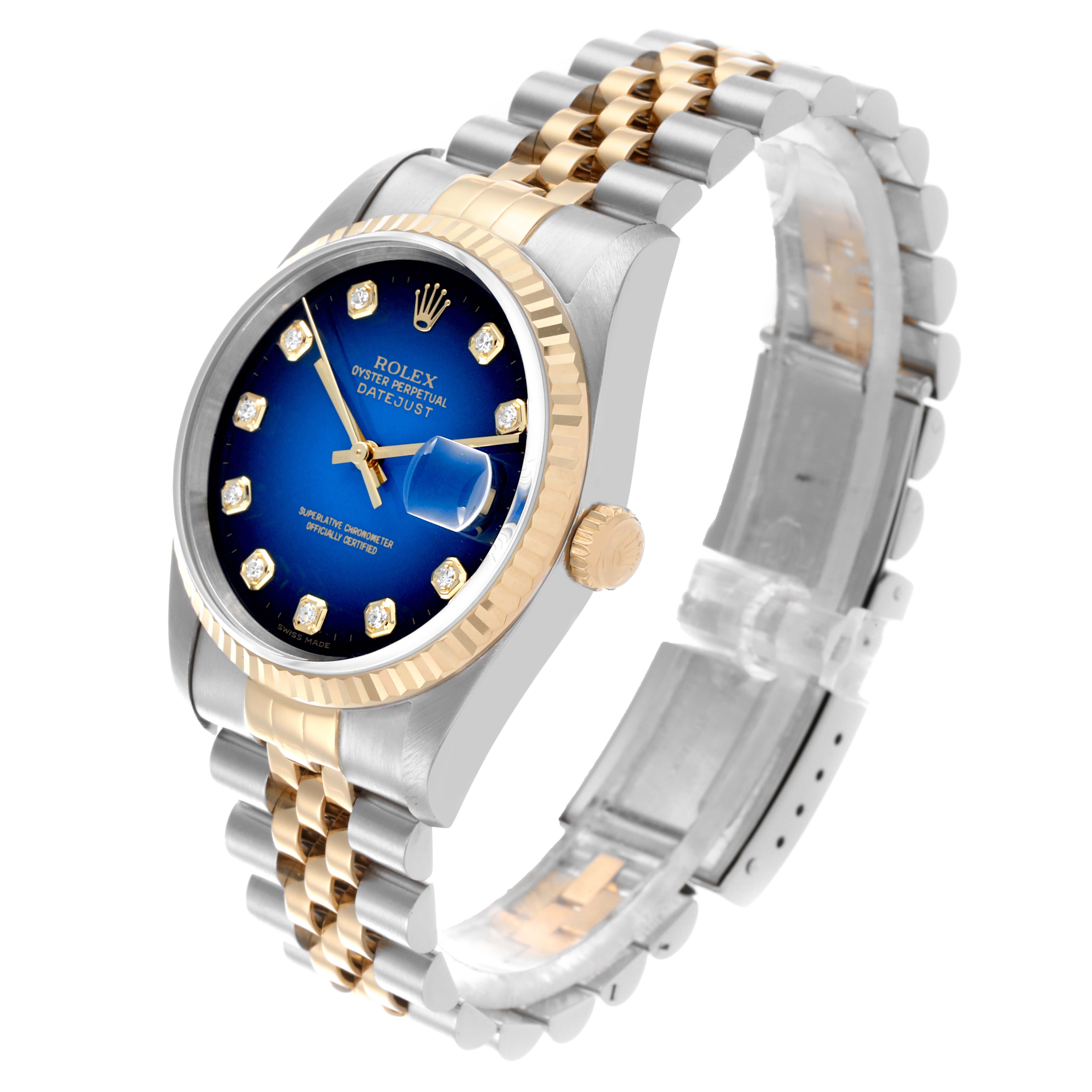 The Rolex Datejust 16233 Men's Steel and Gold (two tone) Blue Dial 16233 Men's Steel and Gold (two tone) Blue Dial watch is shown from a side angle, highlighting the dial, bezel, and two-tone bracelet.