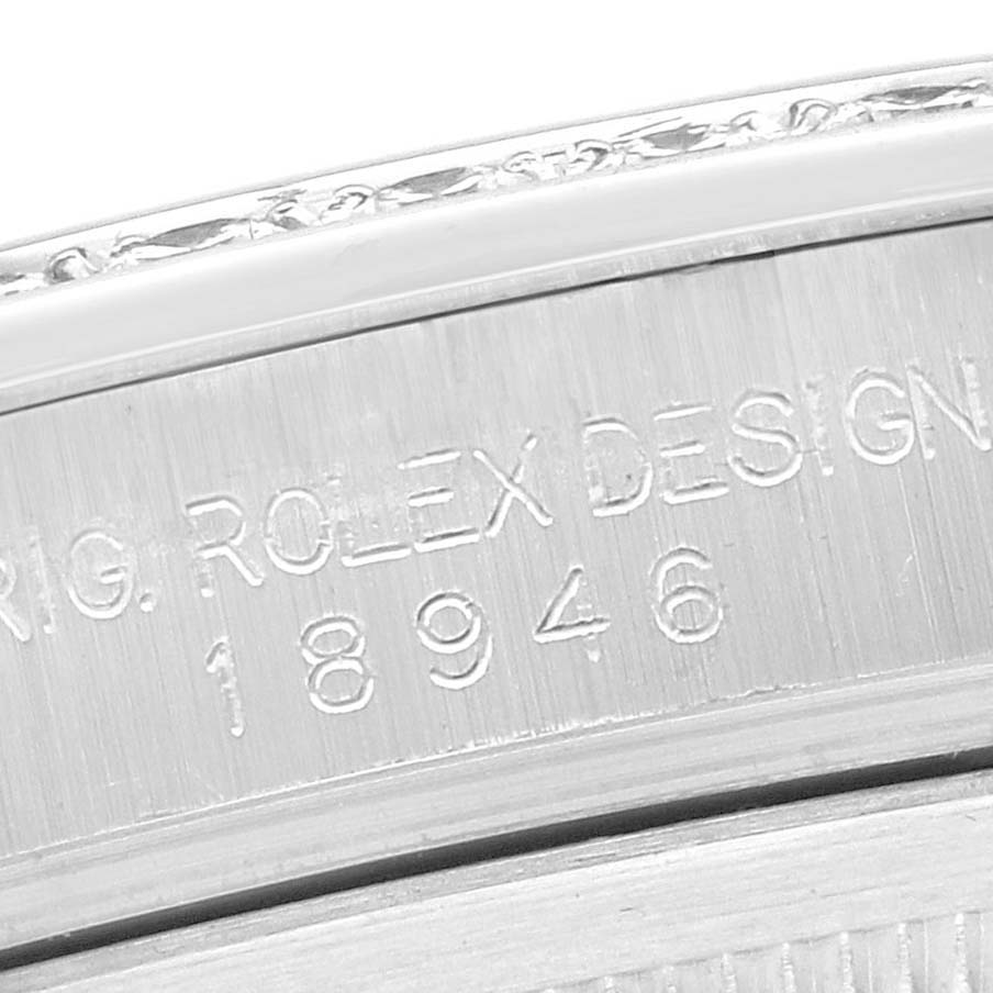 The image shows the side of the Rolex Pearlmaster 18946 Men
s Platinum Silver Dial watch case, highlighting the engraved model and design details.