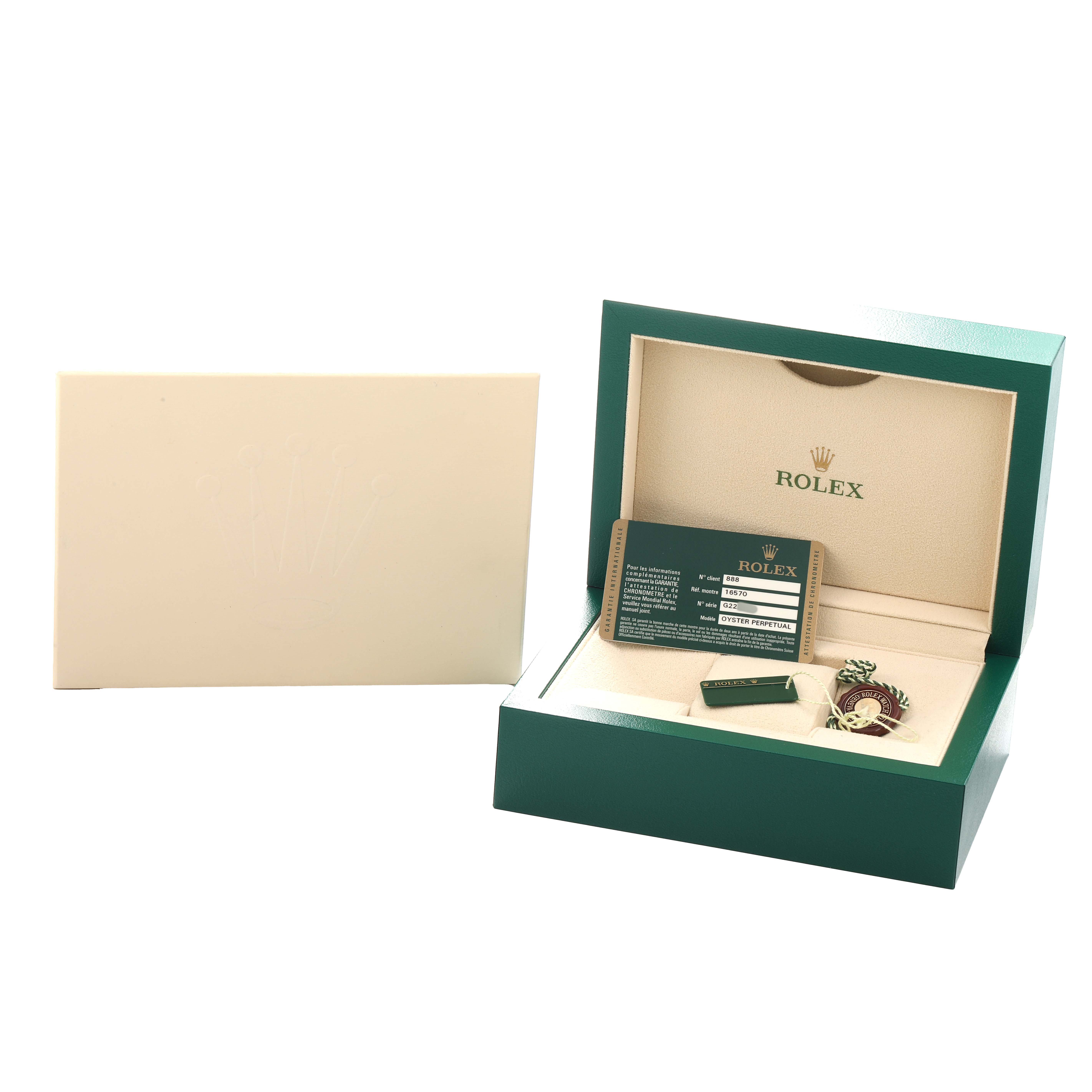 The image shows a Rolex Explorer 16570 Men
s Stainless Steel Black Dial watch box at a slight angle, displaying the warranty card and accessories inside.