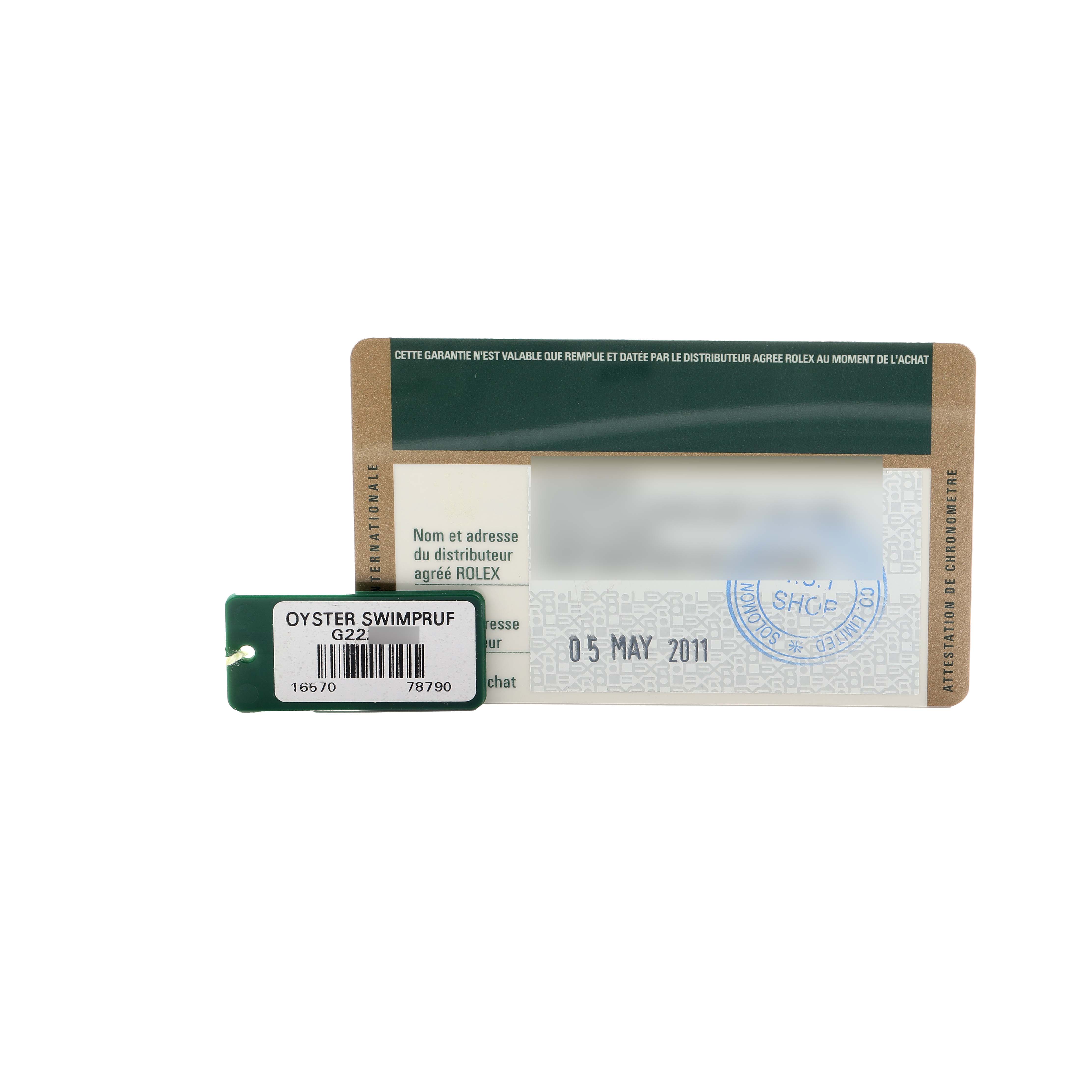 The image shows a warranty card and tag for the Rolex Explorer 16570 Men
s Stainless Steel Black Dial model, highlighting the label and date.