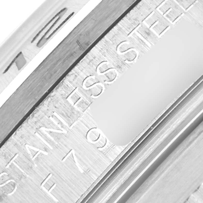 The image shows a close-up of the inner bezel with "STAINLESS STEEL" engraving on the Rolex Explorer 16570 Men's Stainless Steel White Dial 16570 Men's Stainless Steel White Dial.