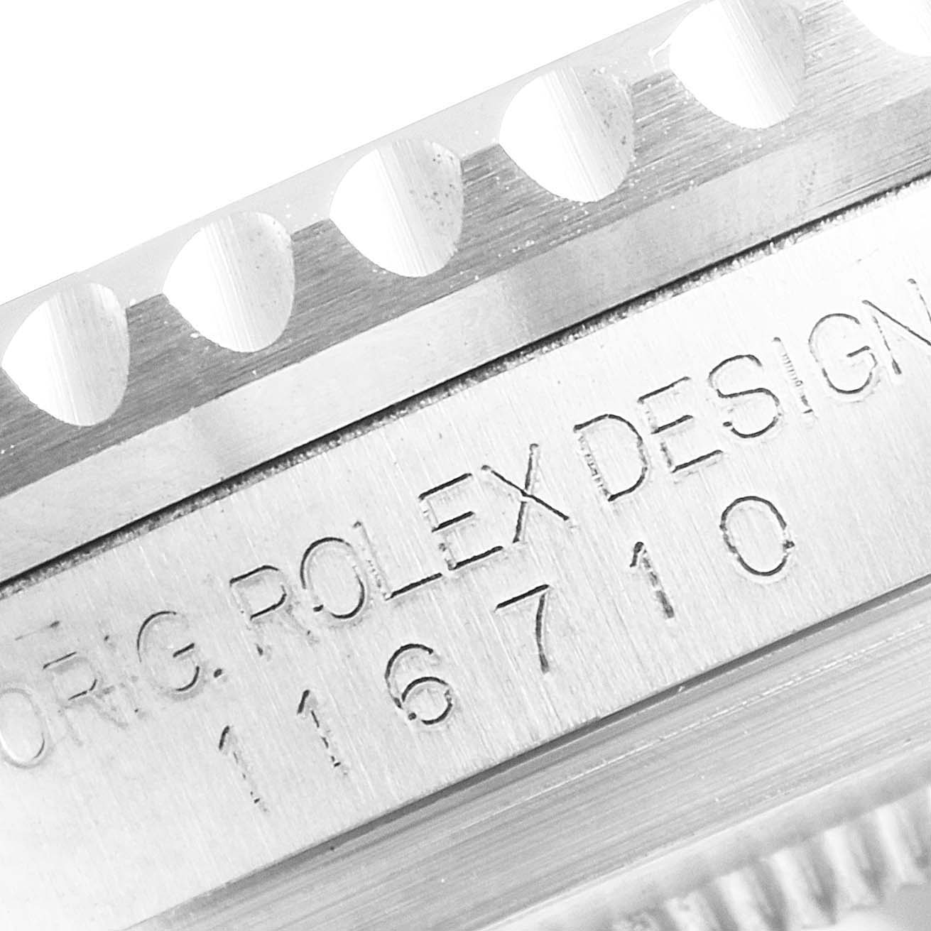 The image shows a close-up of the engraved bezel and case of a Rolex GMT-Master 116710 Men
s Stainless Steel Black Dial 116710 Men
s Stainless Steel Black Dial, displaying the model number 116710.